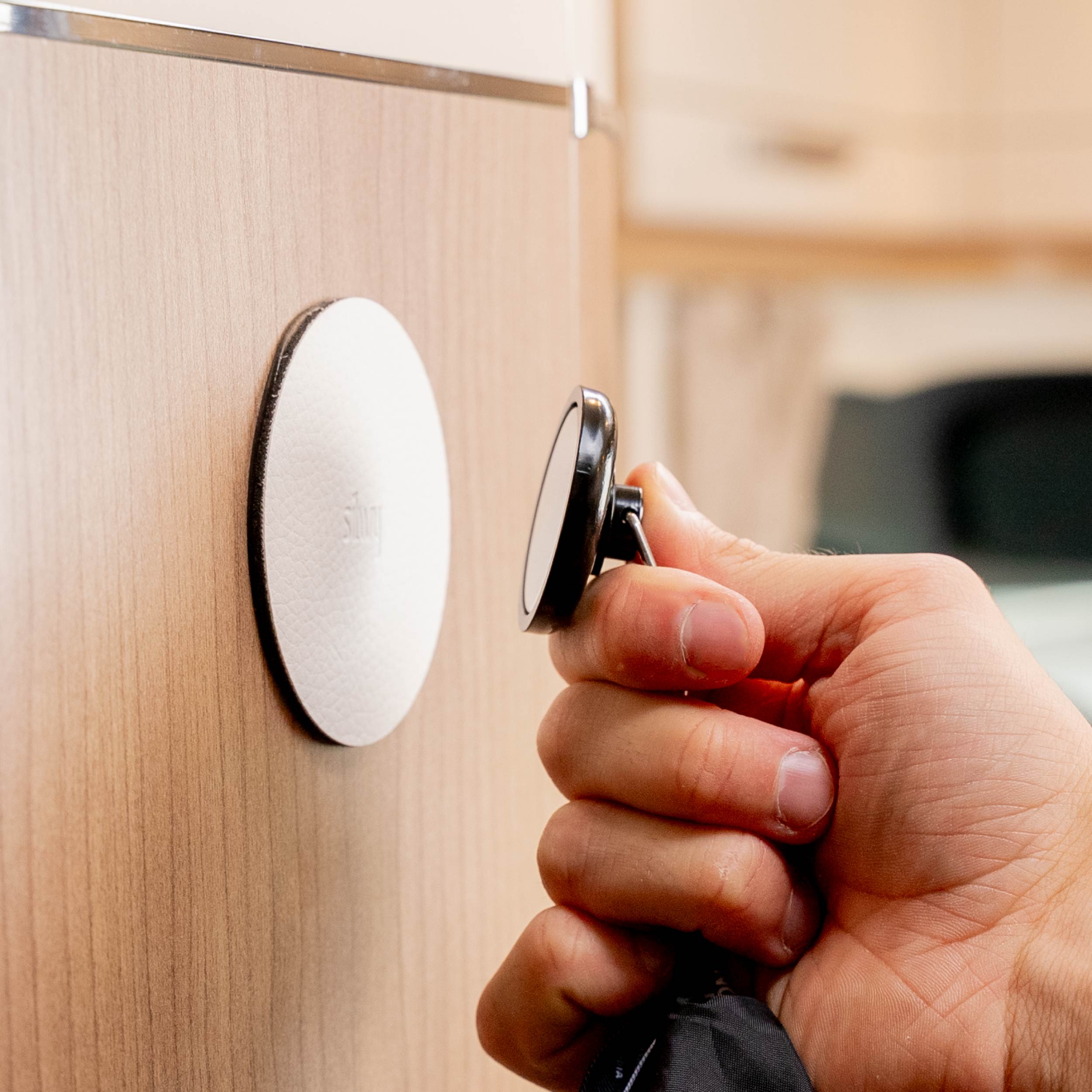 Attach Magnetic hook to metal pad in the camper