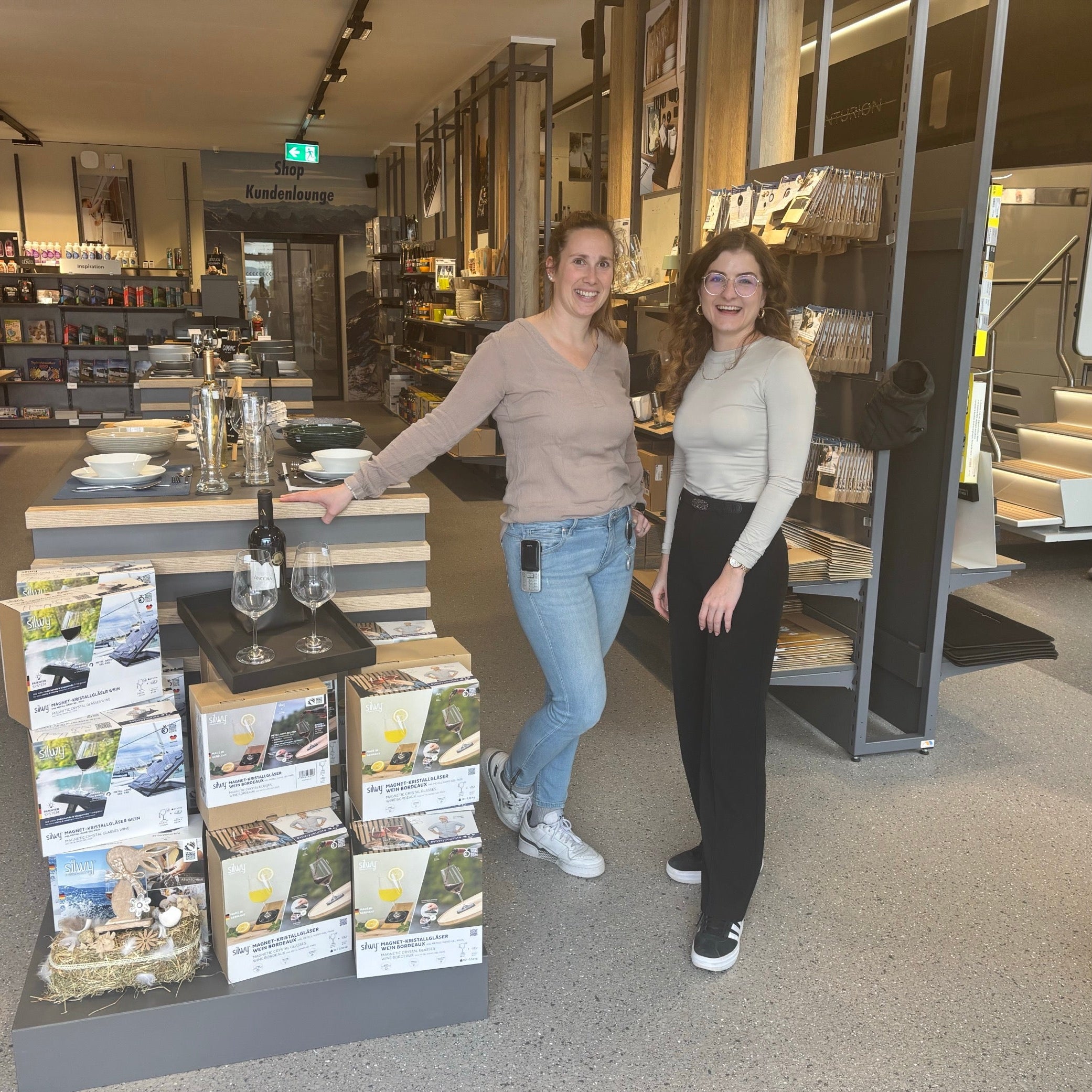 Two people at a silwy retailer