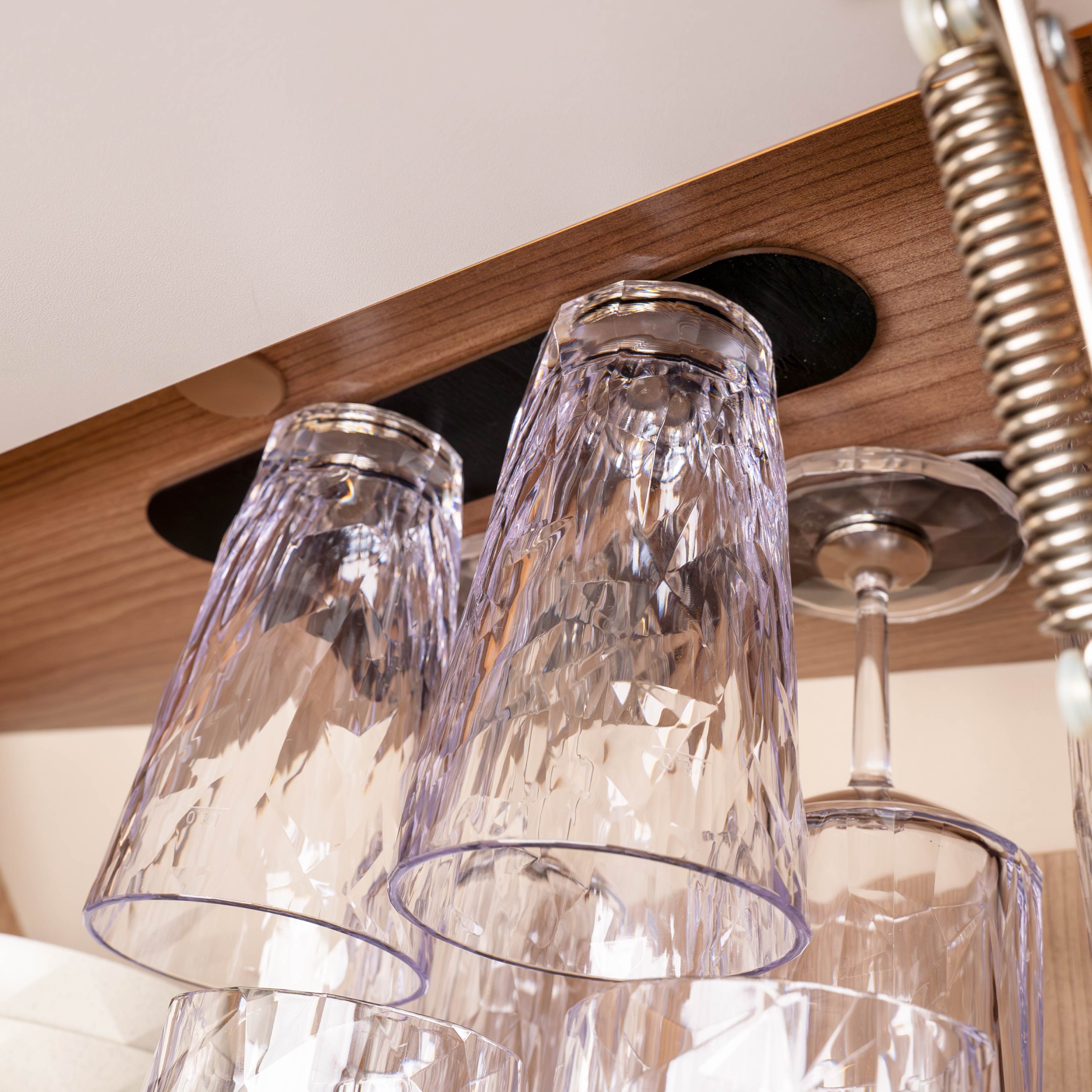 Plastic glasses on overhead rail