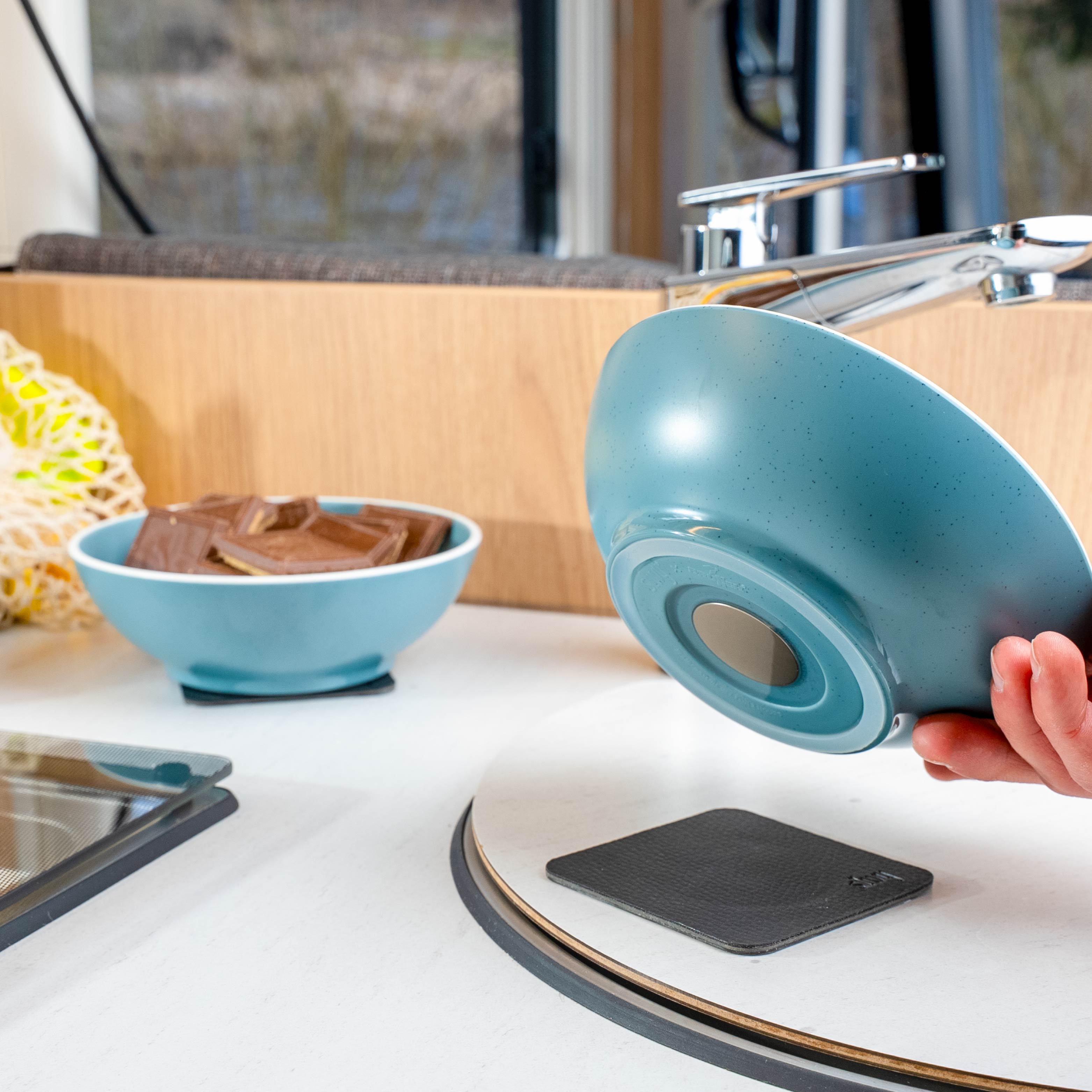 Putting down the magnetic plastic bowl