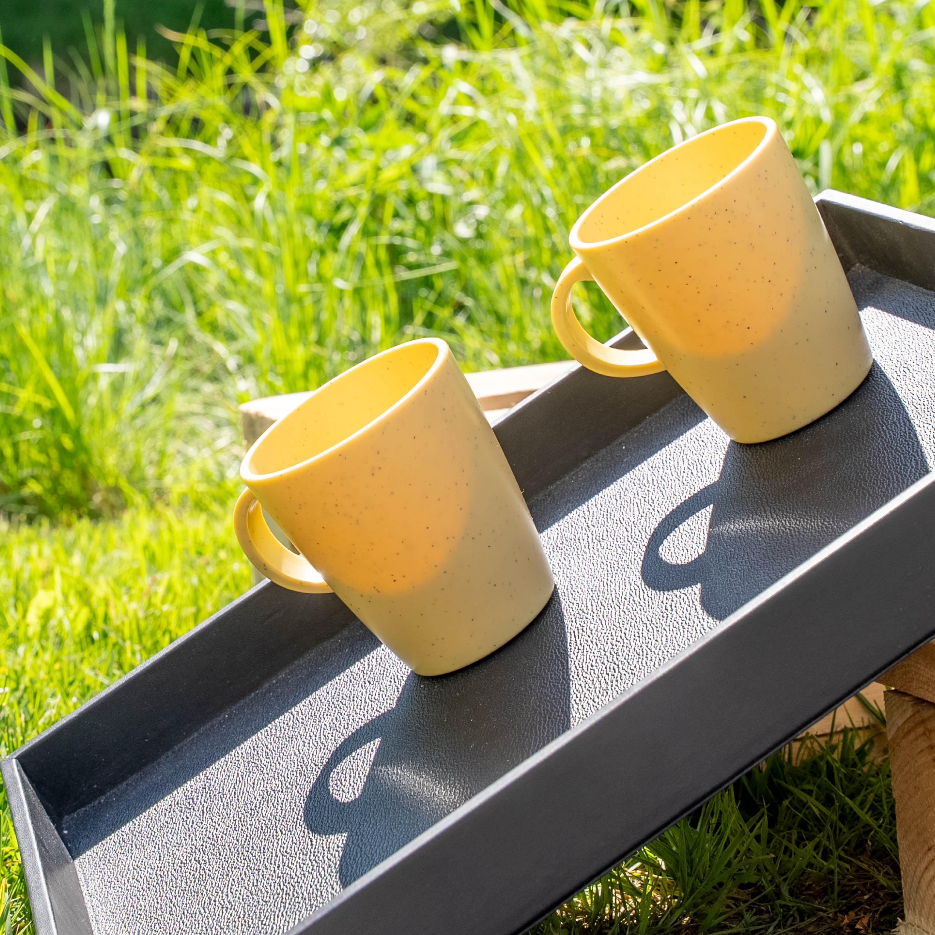 Magnetic plastic cups yellow on metal tray