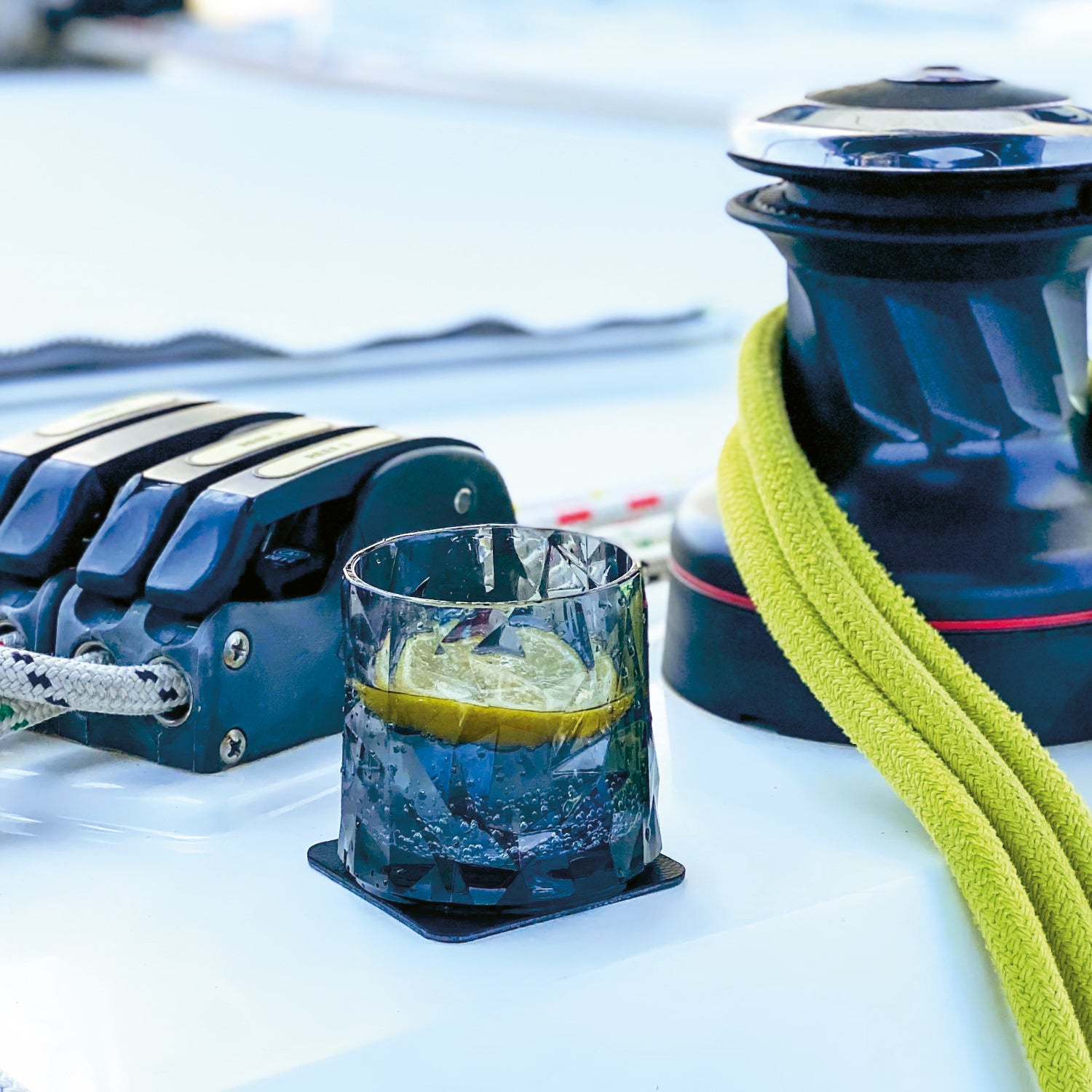 Plastic glass tumbler standing on a pad on a boat