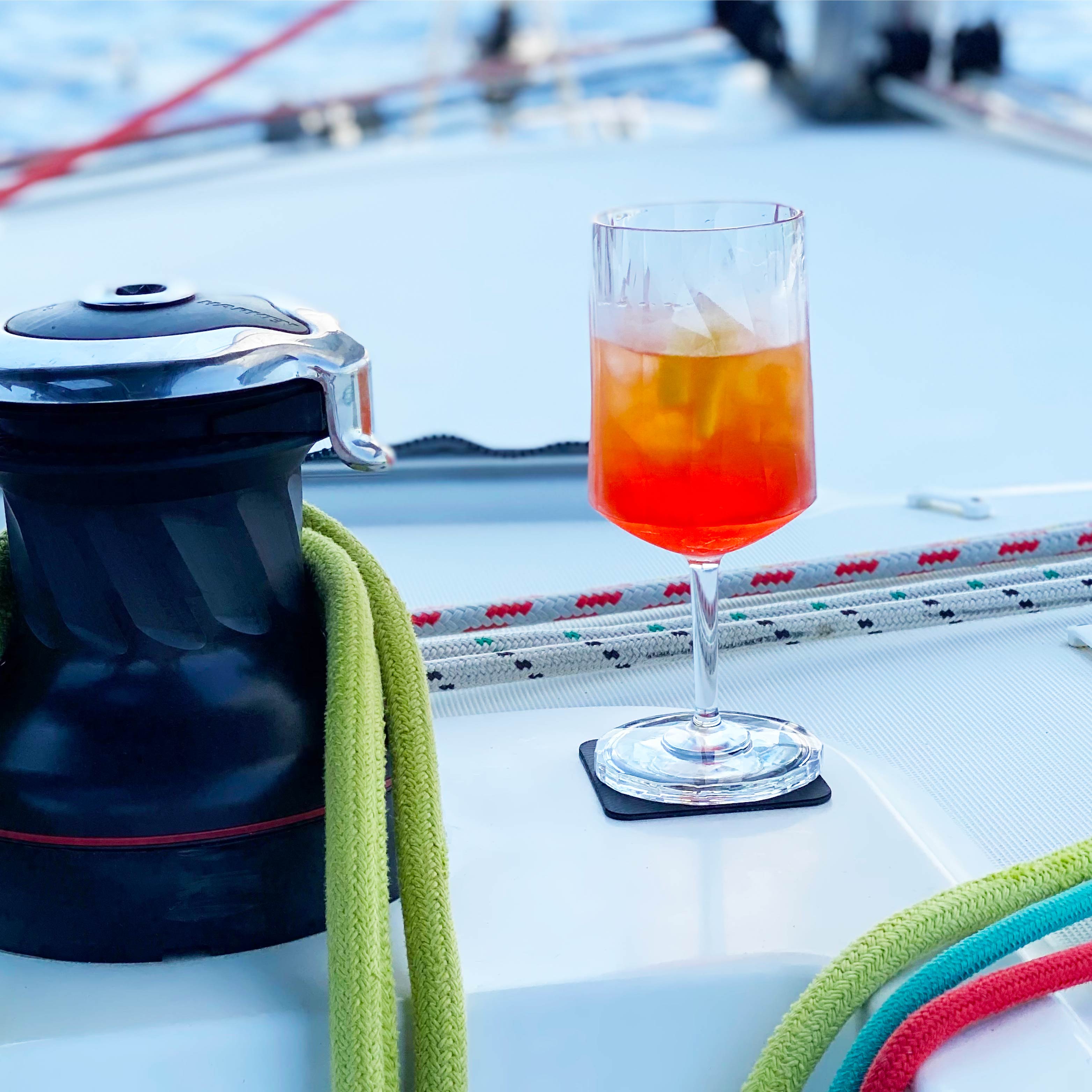Magnetic plastic glass wine on a pad on a boat