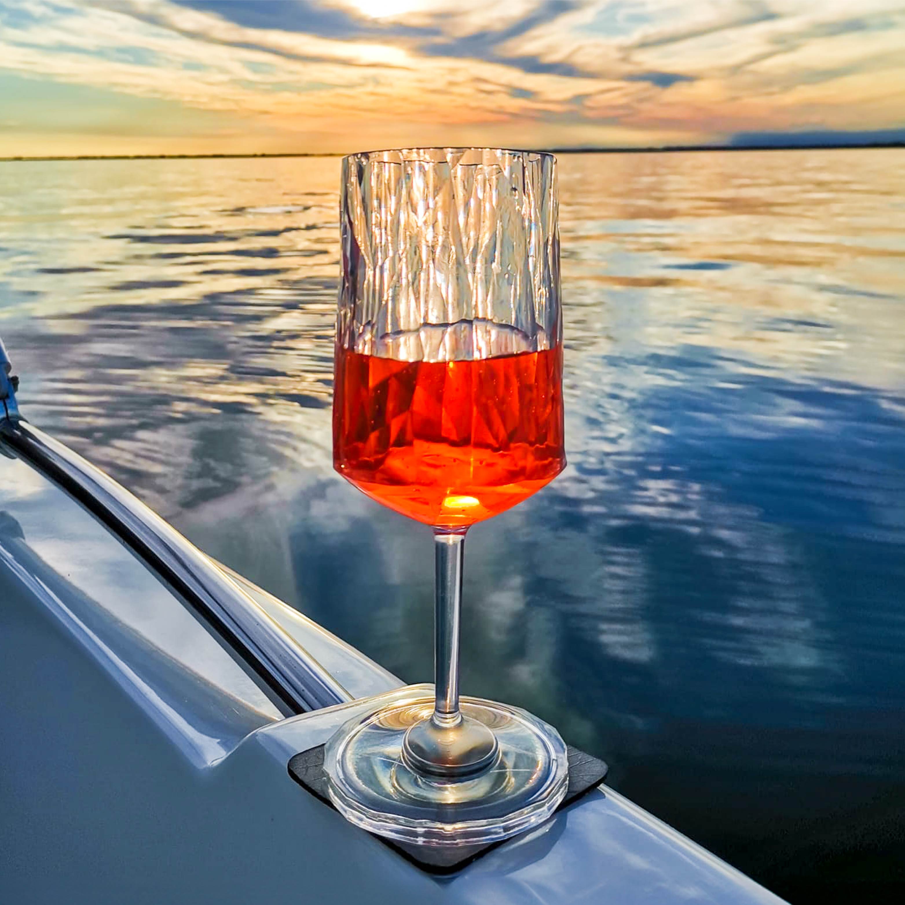 Magnetic plastic glass wine on a pad on a boat