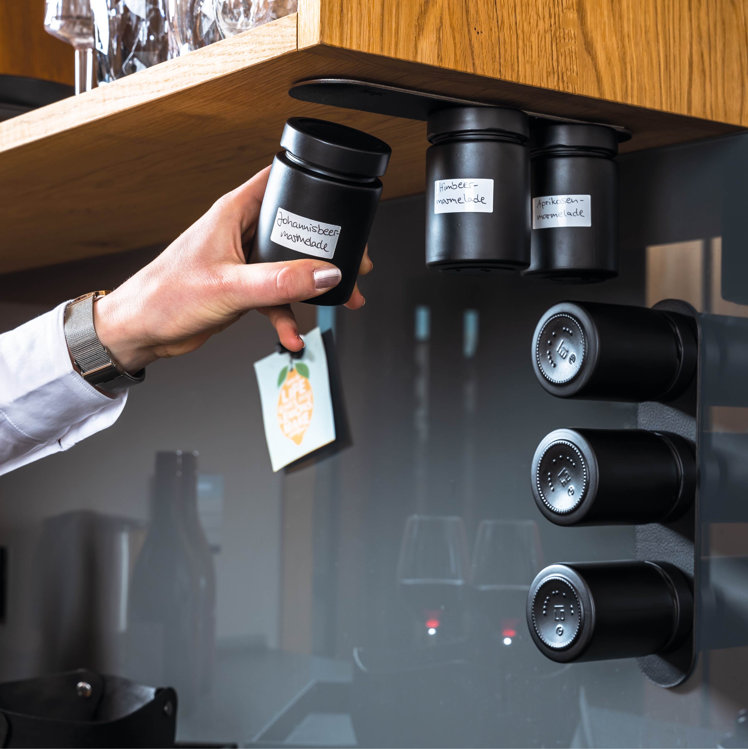 Magnetic deli jars mounted on Metal Strip in kitchen environment