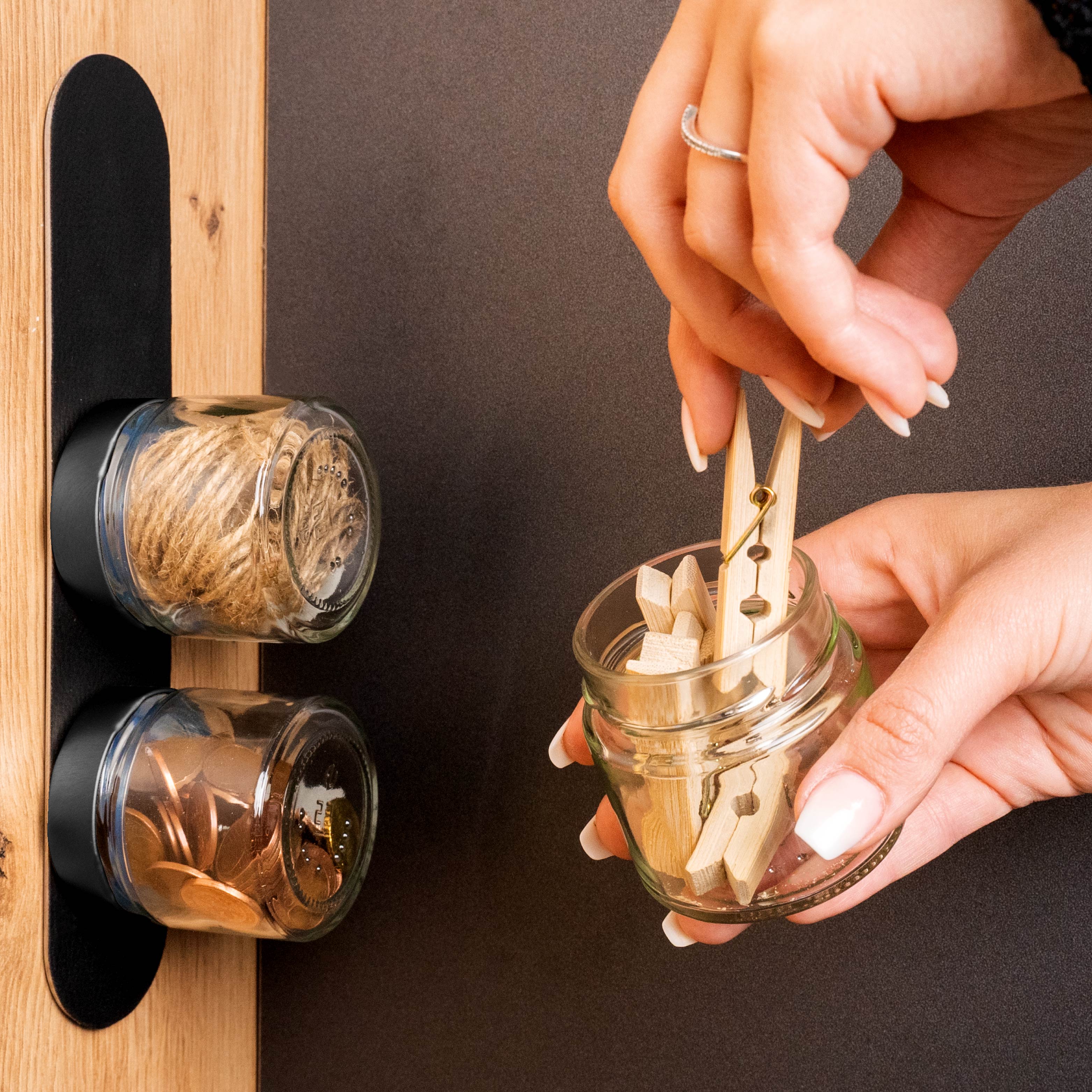 Magnetic deli jars fixed to Metal Strip filled with office utensils
