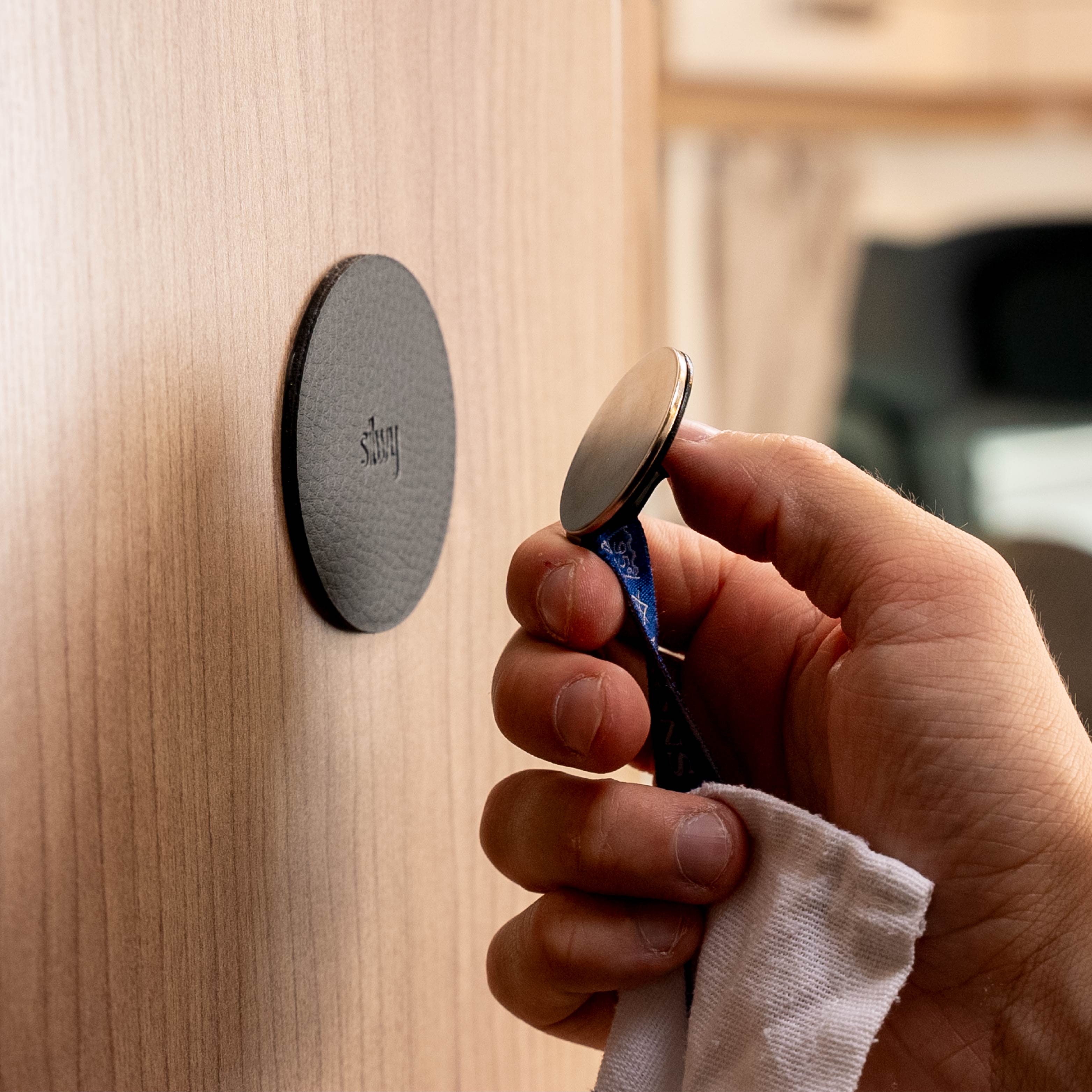 Magnetic hook is held in place by a metal pad