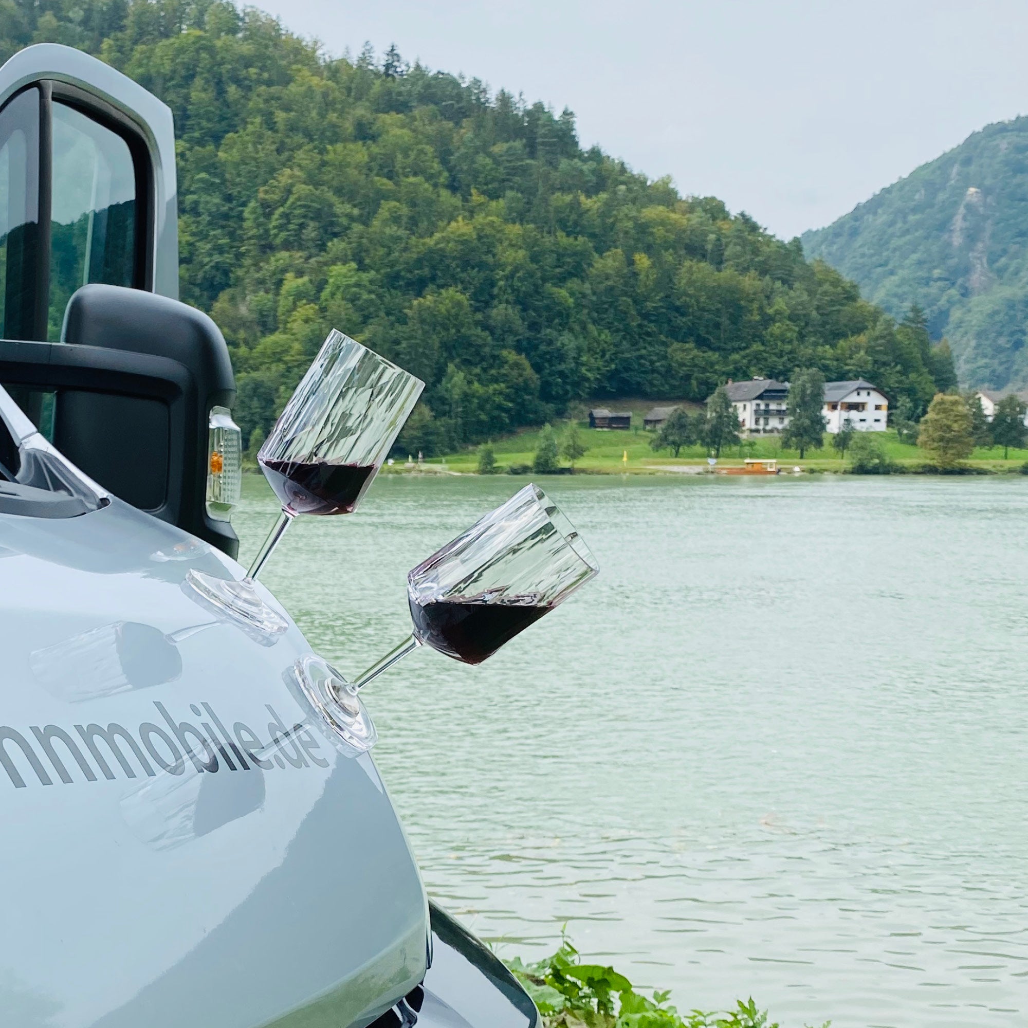 Plastic glass wine placed on hood