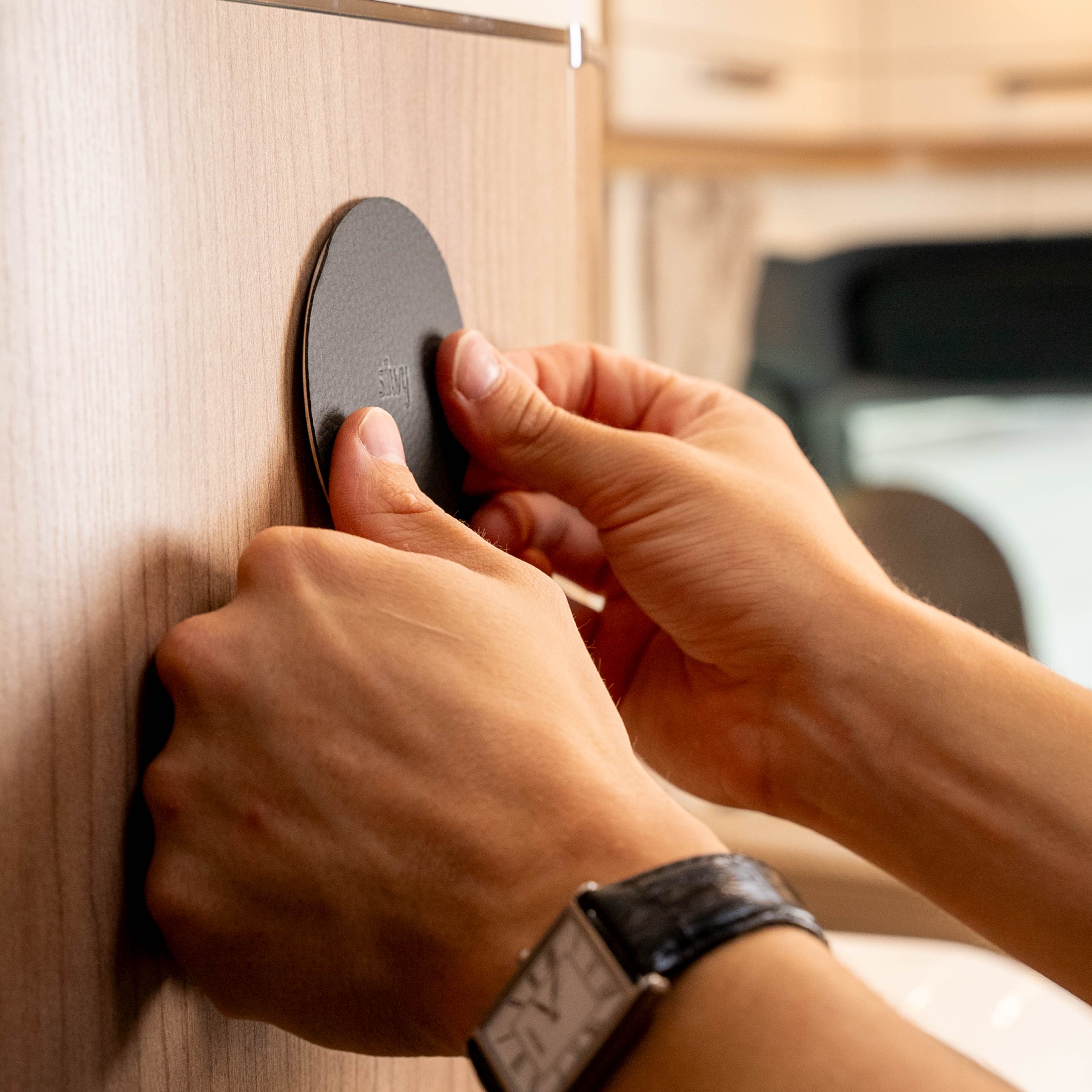 Press the pad firmly onto a smooth surface in the camper