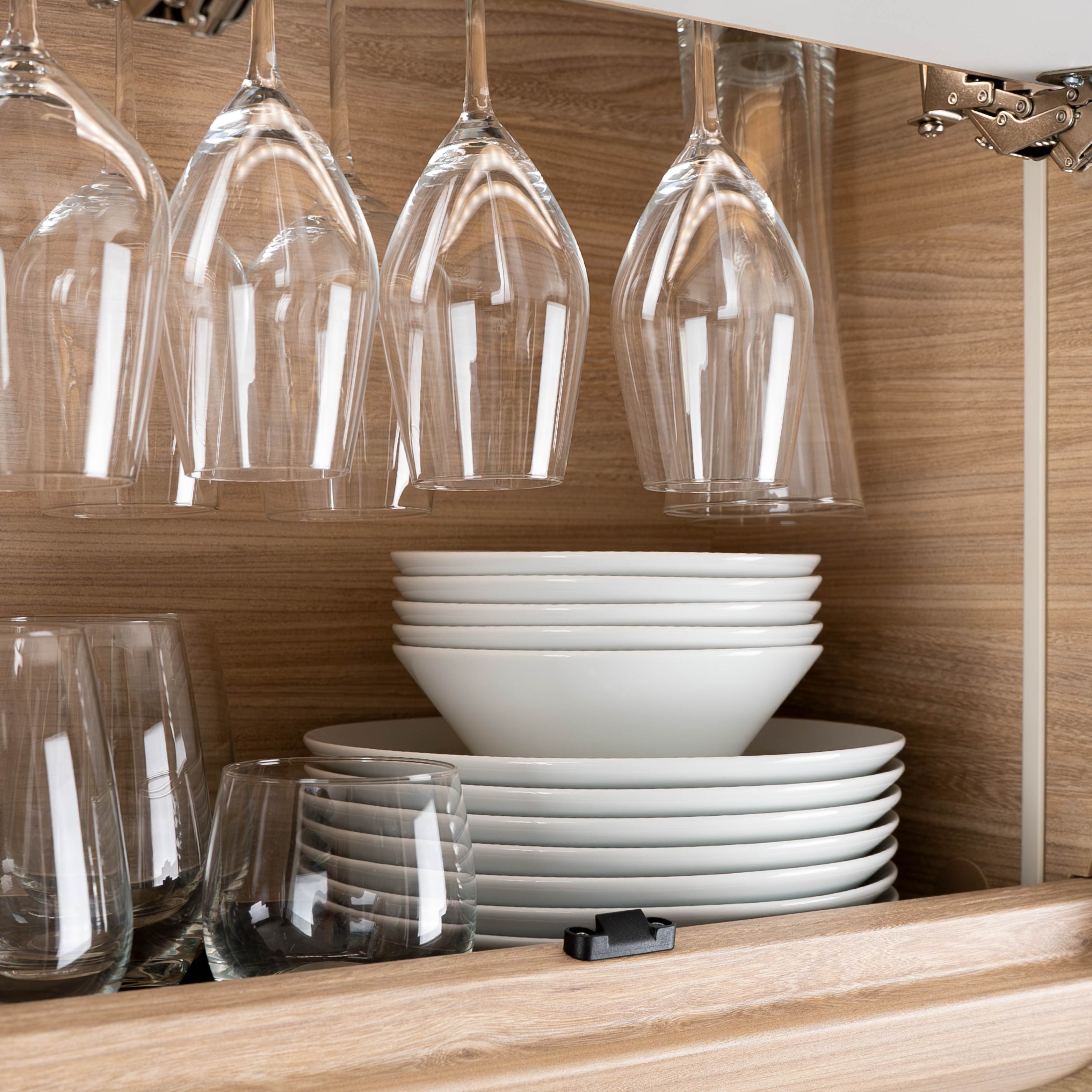 Magnetic porcelain Bowls and magnetic porcelain plates stacked on top of each other on the shelf and Magnetic glasses champagne hanging on the shelf 