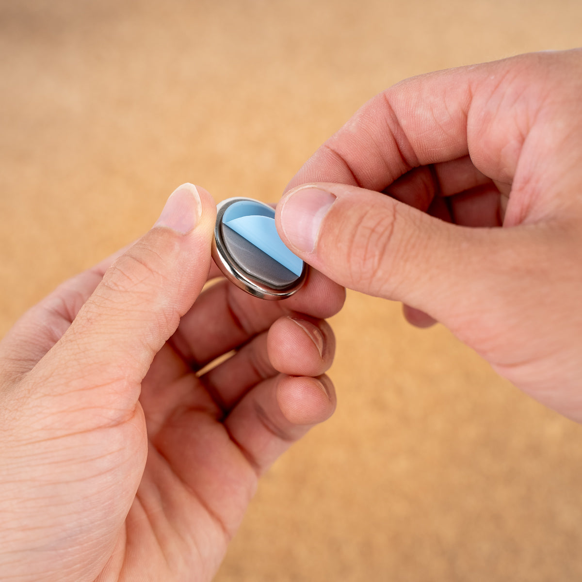 Remove protective film from magnet 