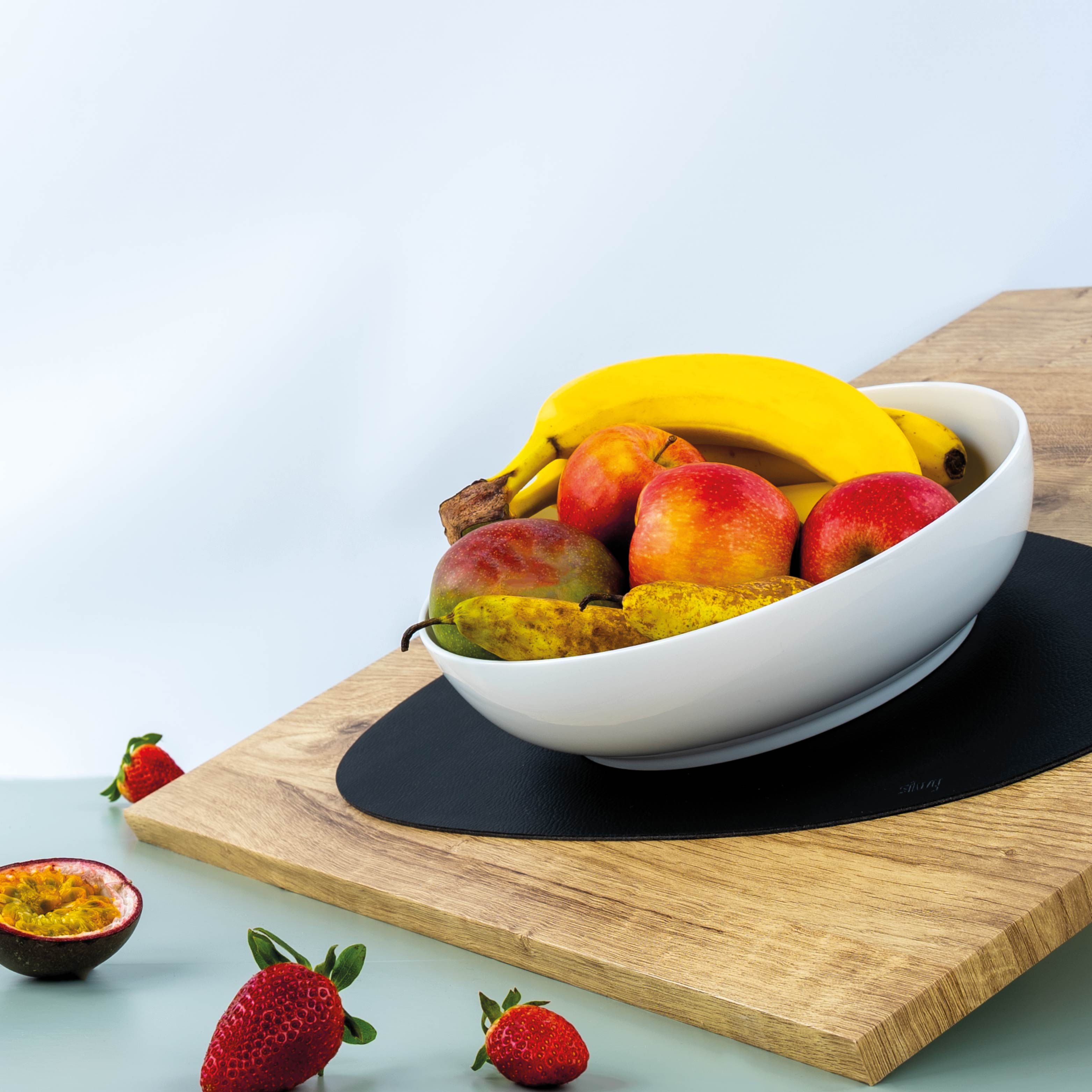 Magnetic food bowl is fixed in an inclined position by a placemat