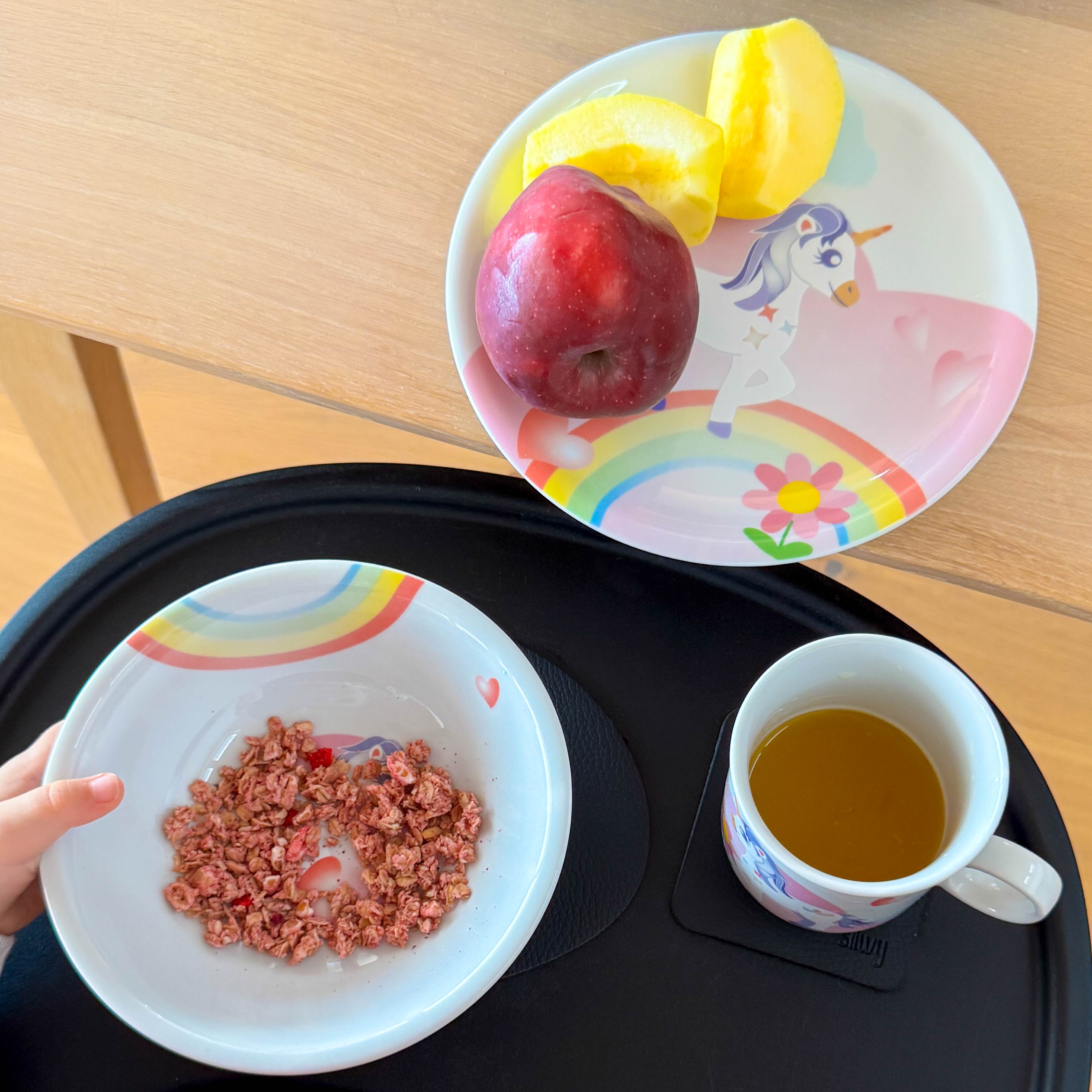 Children's collection placed on placemat with magnet