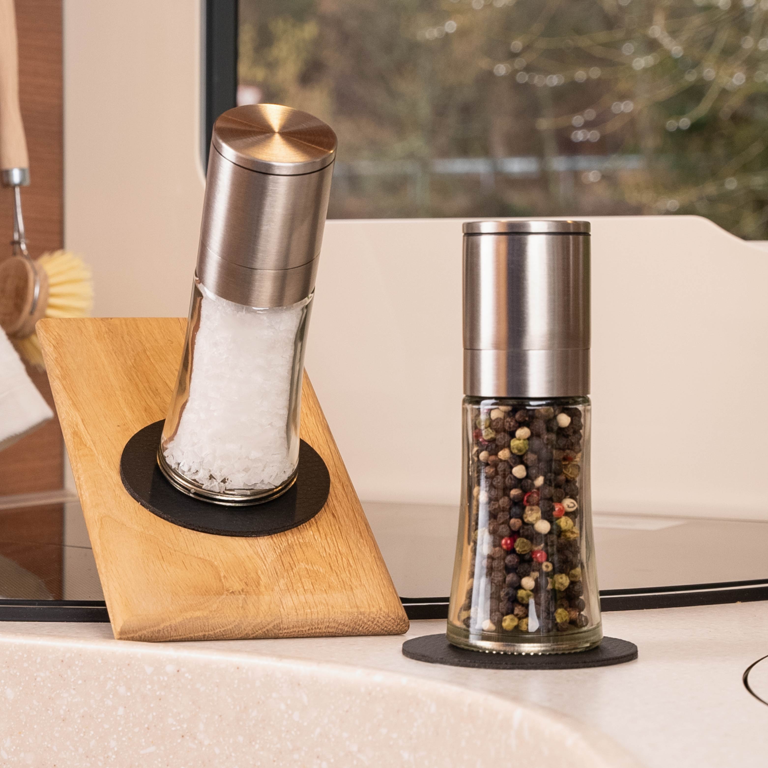 Magnetic deli jars on metal pads in the camper in an inclined position