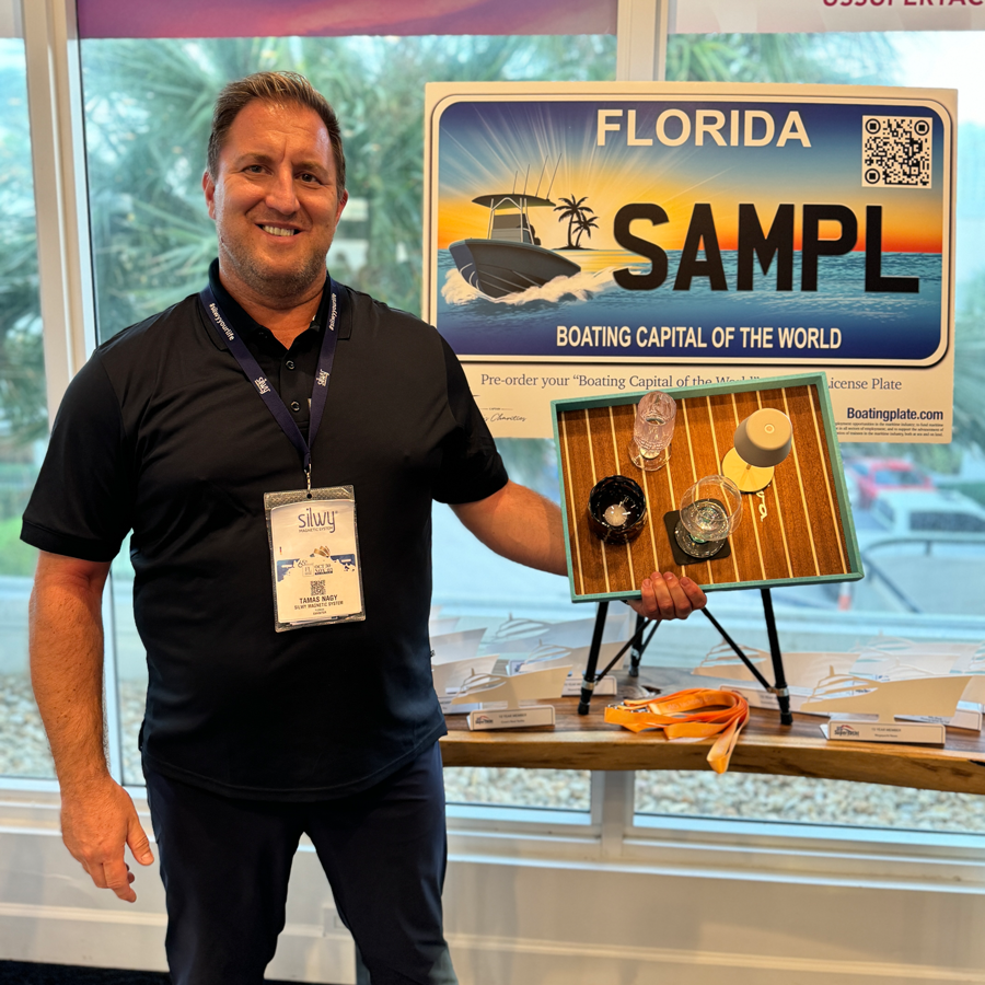 Tamas employee with silwy tray and corresponding products in hand