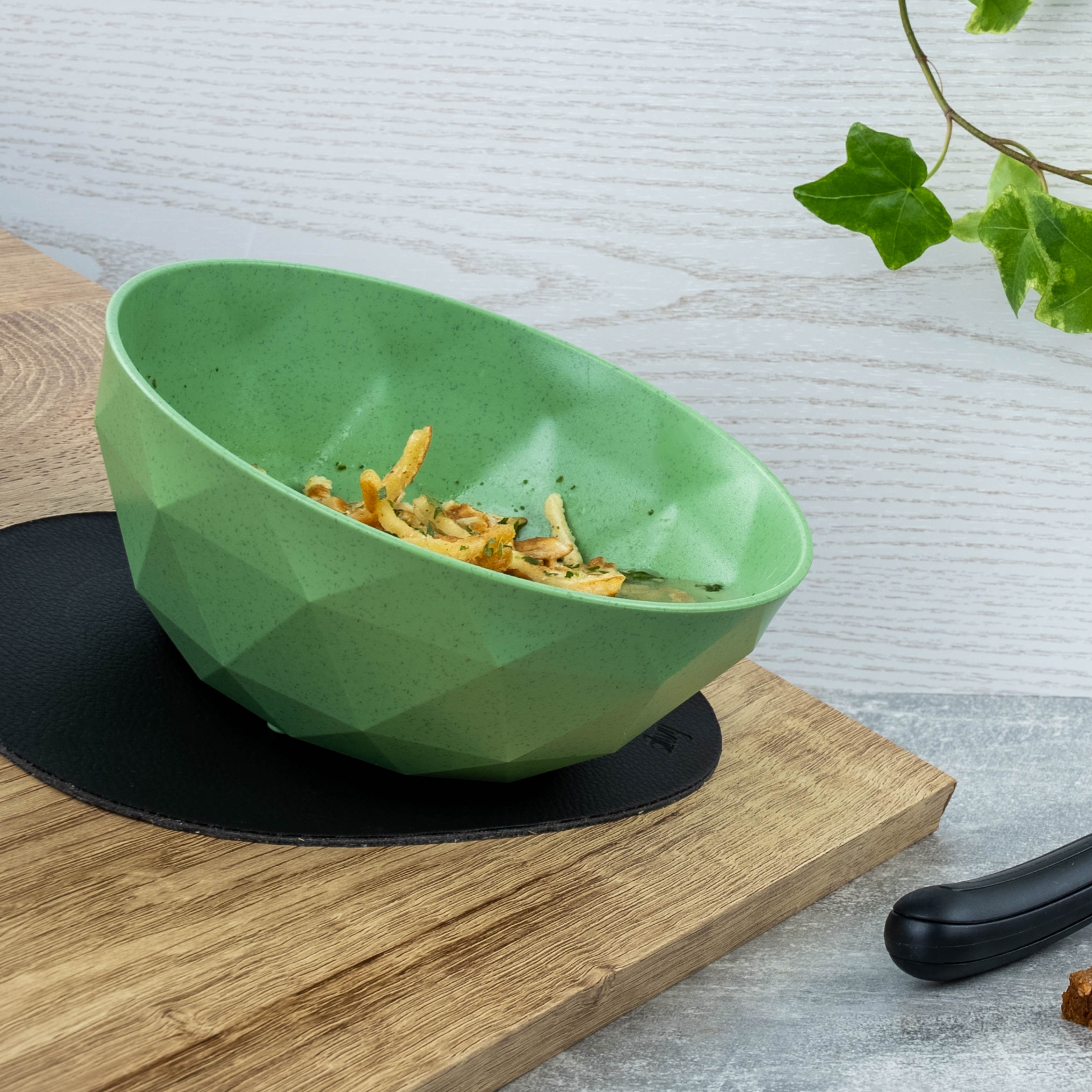 Magnetic bowl is fixed in an inclined position by a metal placemat