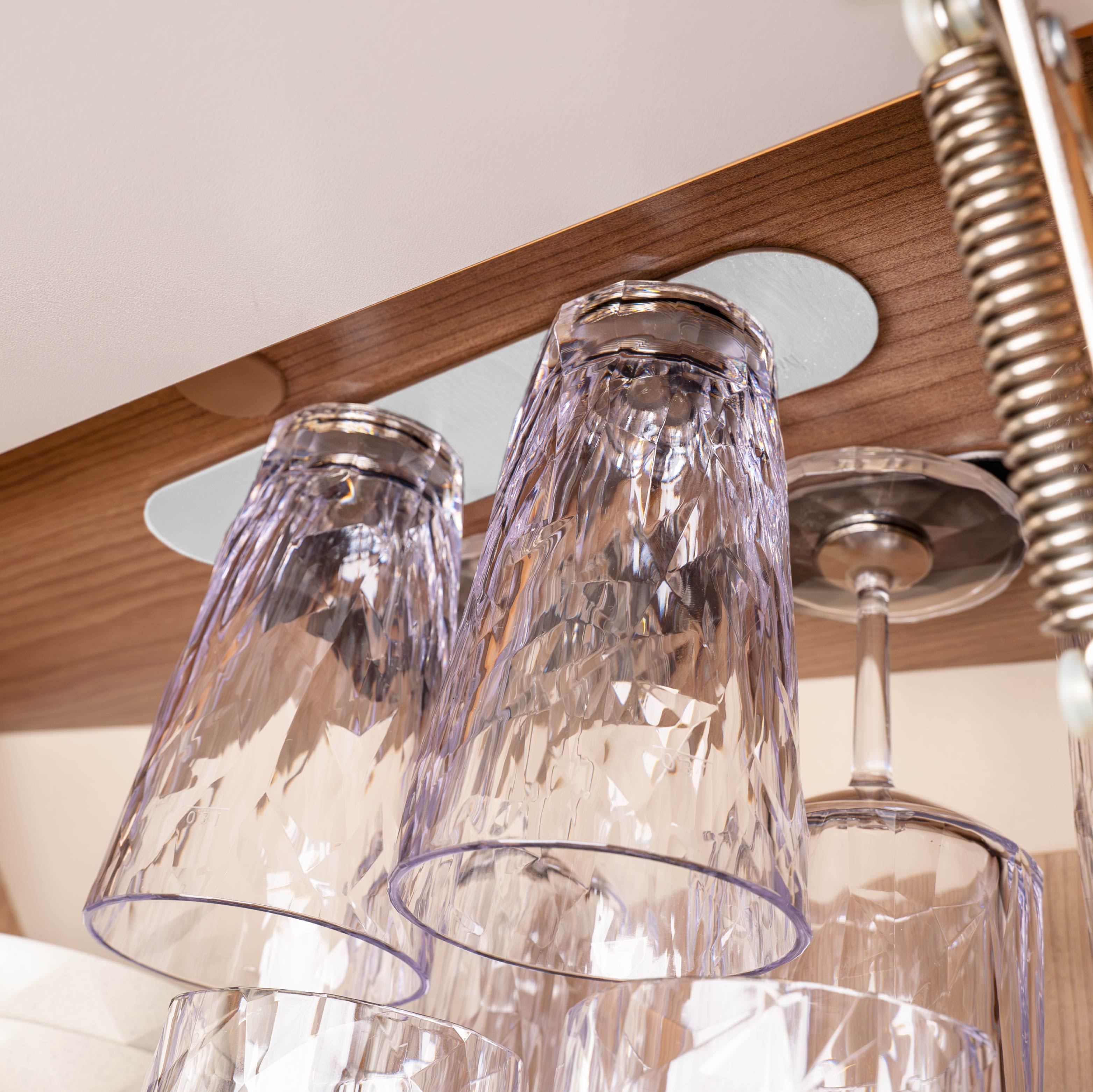 Plastic glasses on ceiling overhead 