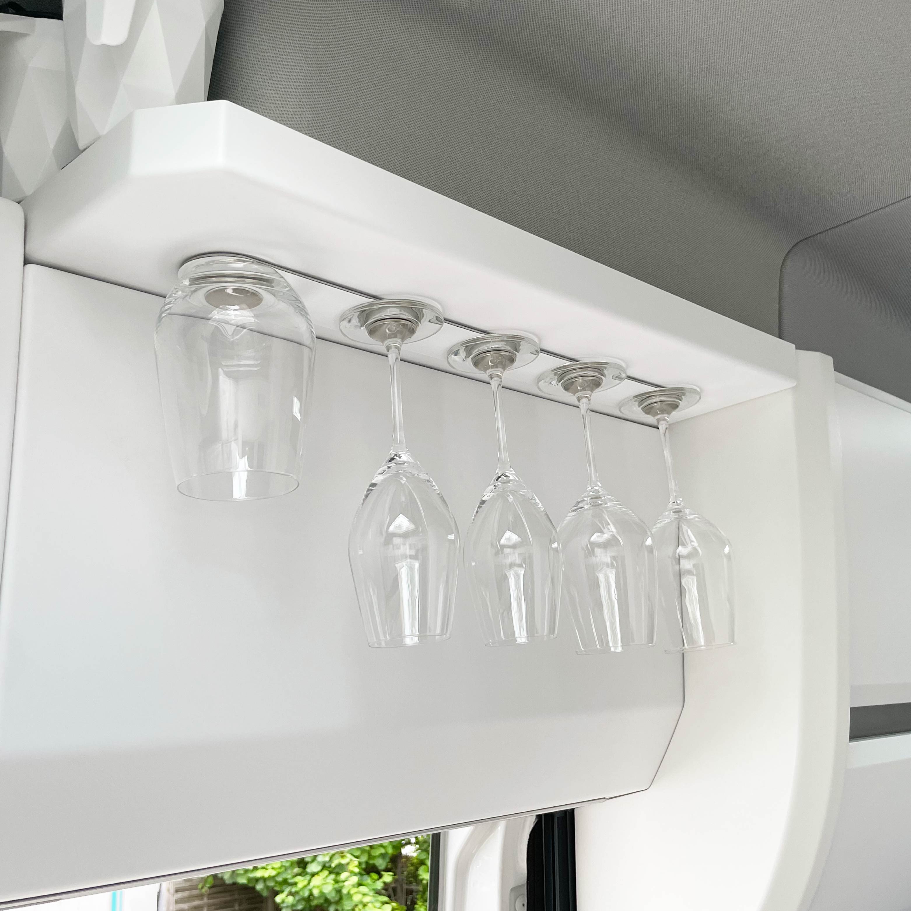 Glasses mounted upside down on a white 50cm rail