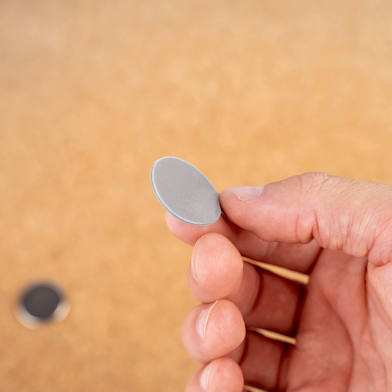 Attach the 3M adhesive dot to the magnet, remove the protective film and then attach to the desired object