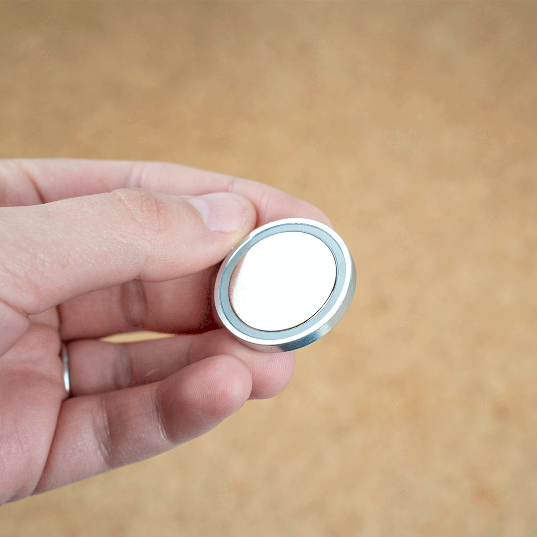 Attach 3M adhesive dot to magnets, remove protective film and then attach to coffee machine