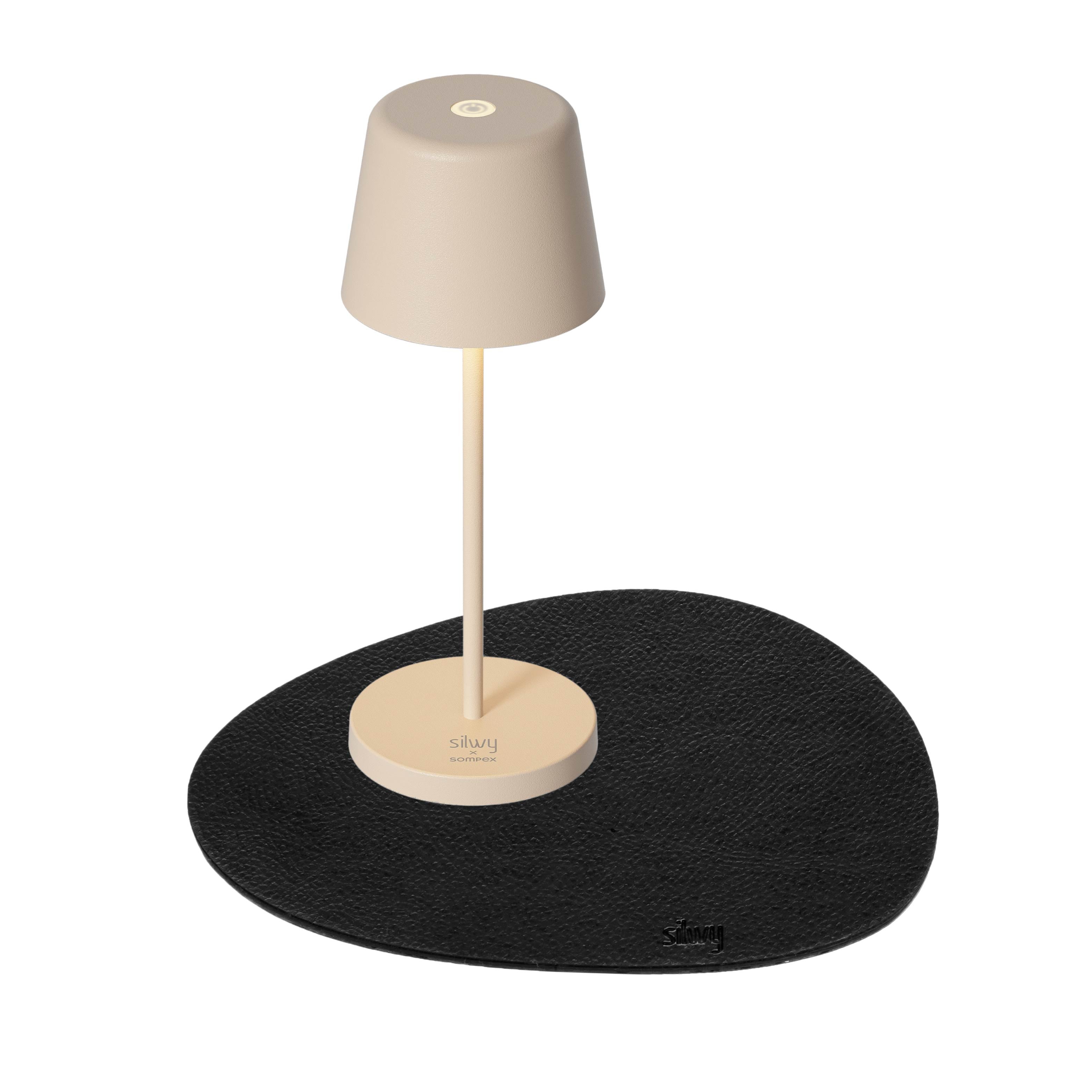 Magnetic lamp Monaco in Sand on accompanying placemat 