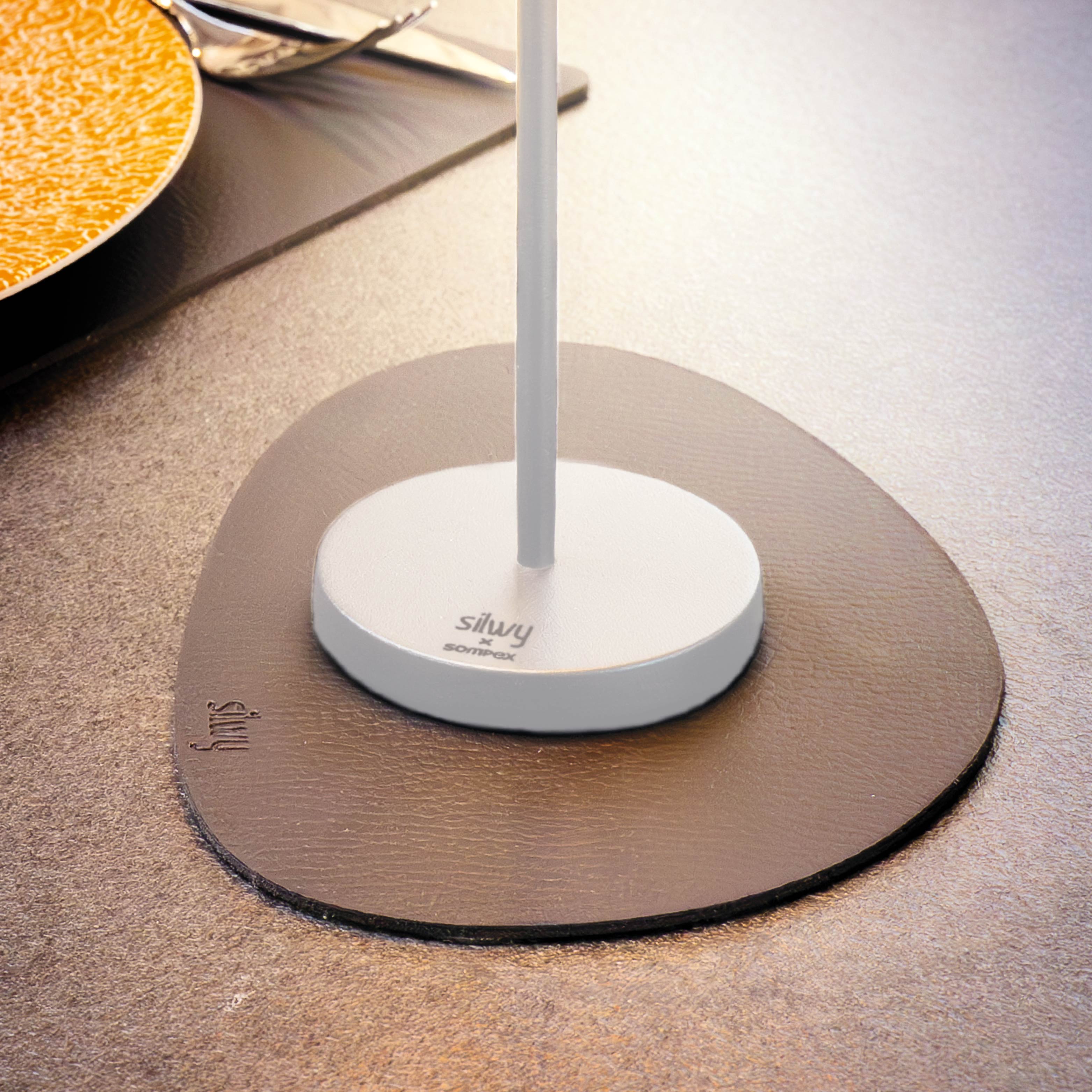 Magnetic lamp Monaco in white on accompanying placemat 
