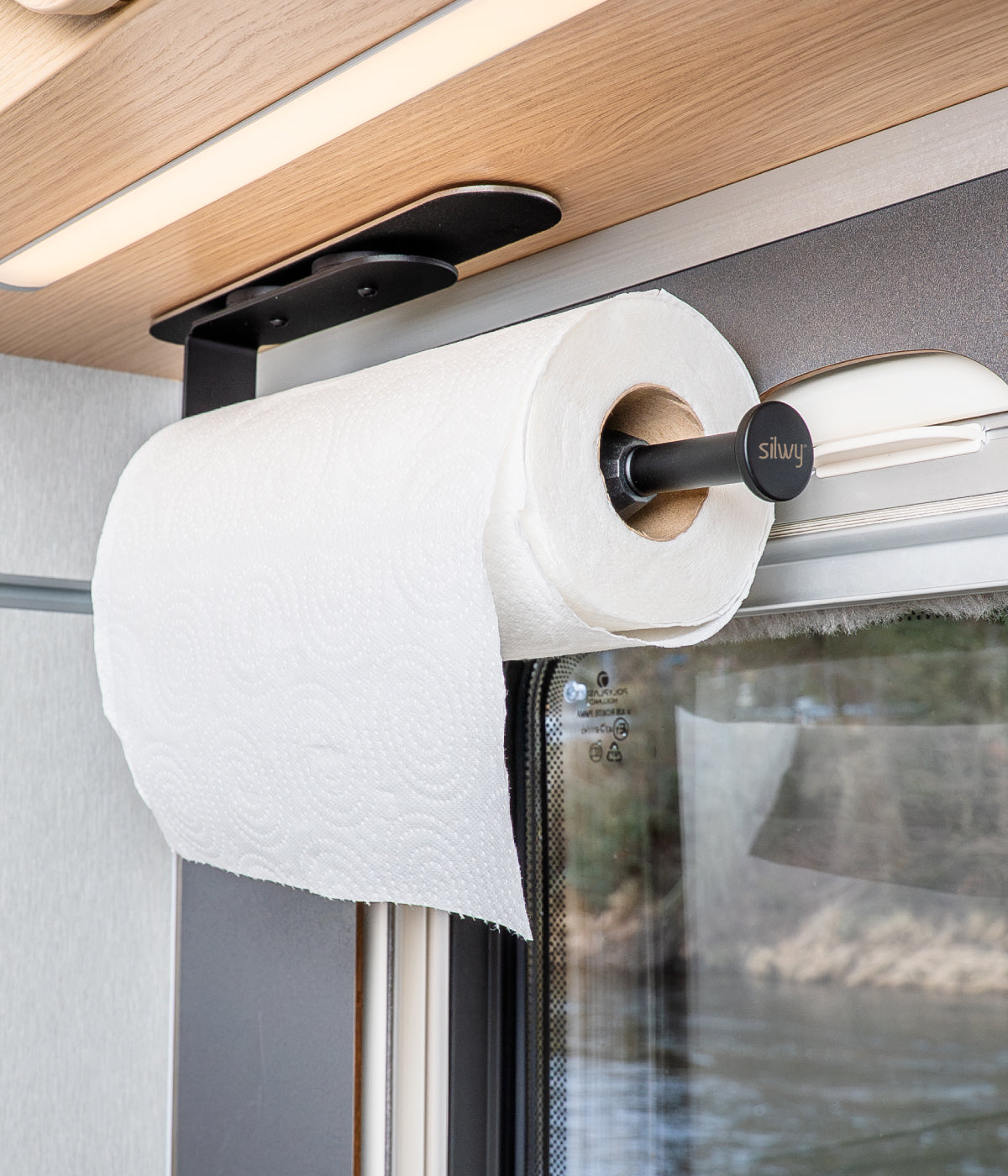 Kitchen roll holder fixed to rail in the camper