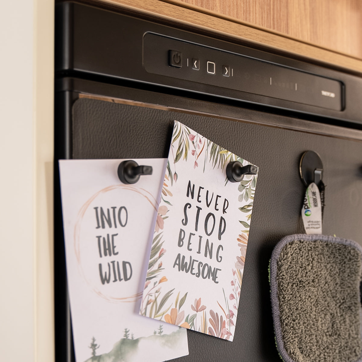 Cards "Into the wild" and "Never stop being awesome" as well as pot holders with Magnetic pins and Magnetic hook attached to the wall 