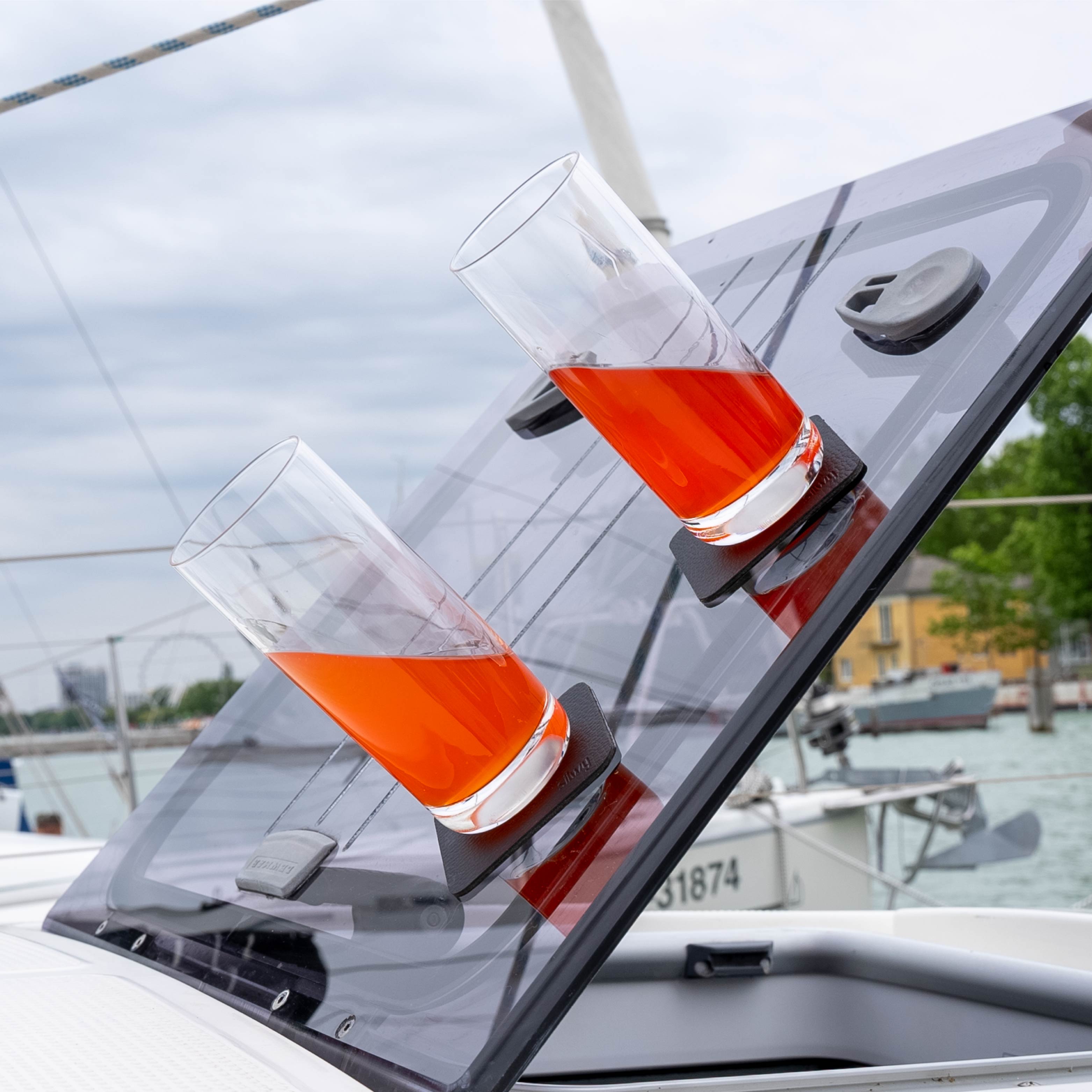 Magnetic crystal glasses longdrink slim placed on the pads in an inclined position on the boat