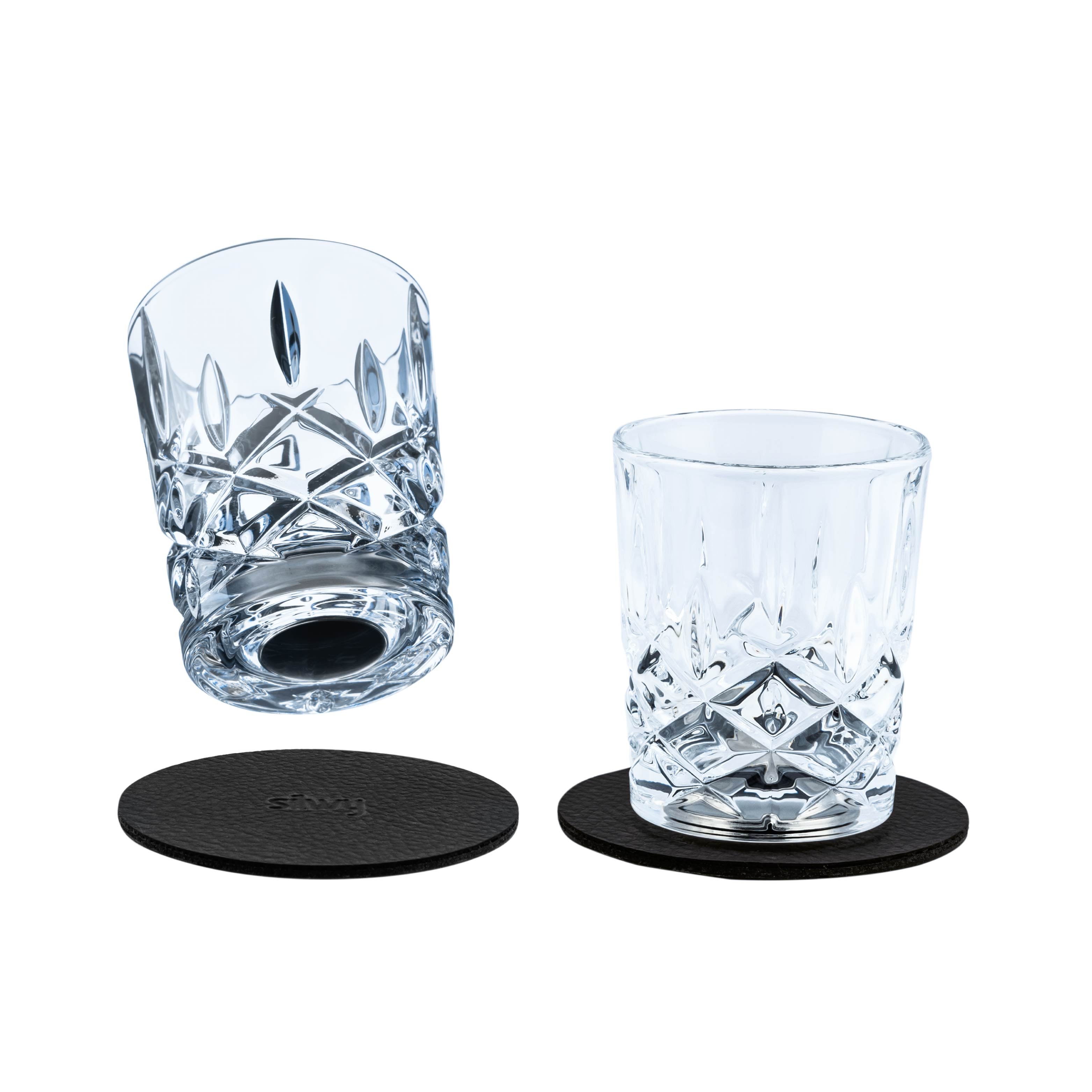 Two Magnetic crystal glasses shot with integrated magnets in the base and the round Metal nano gel pads 