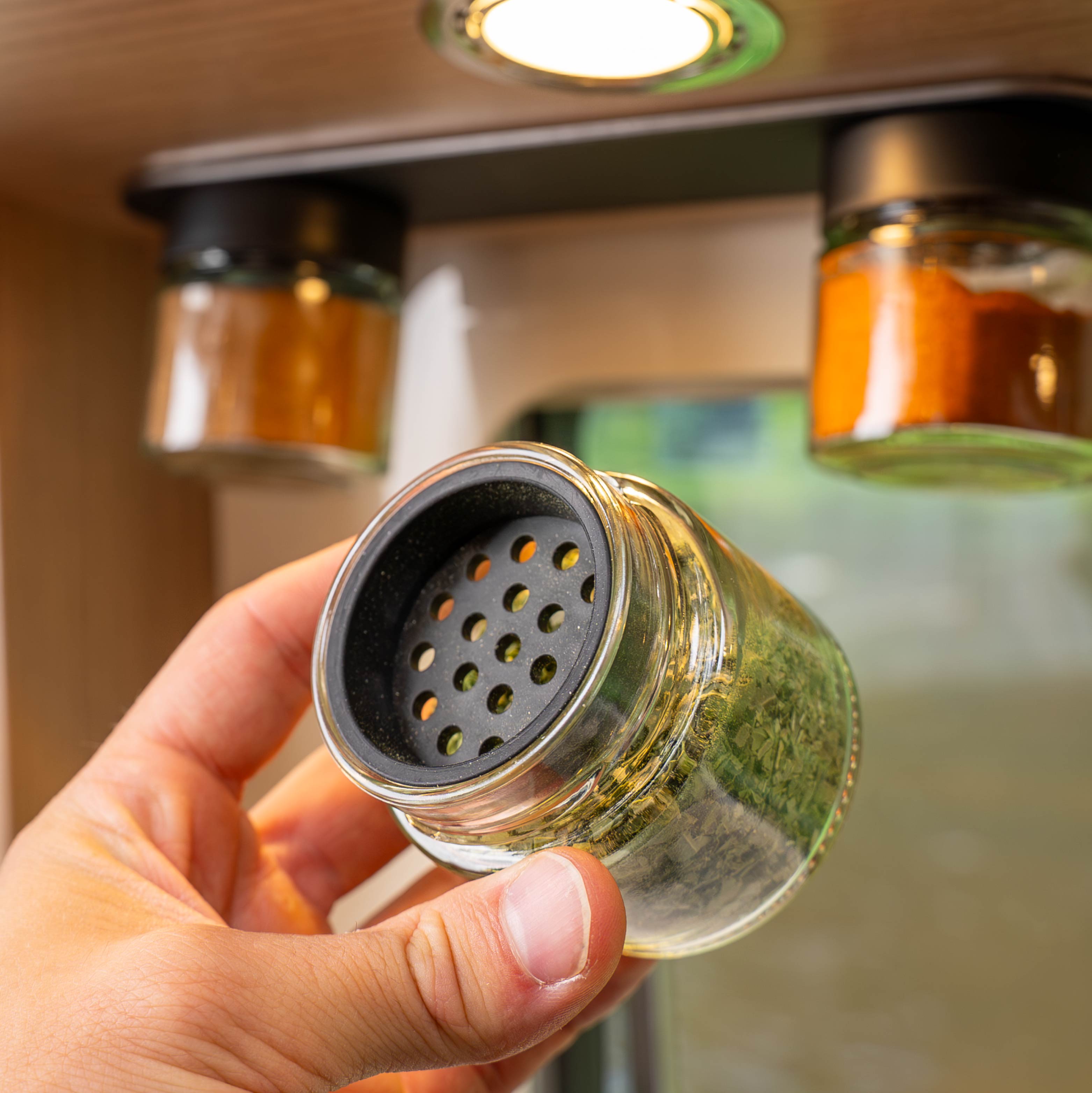 Sprinkling insert in delicatessen jar with coarse holes