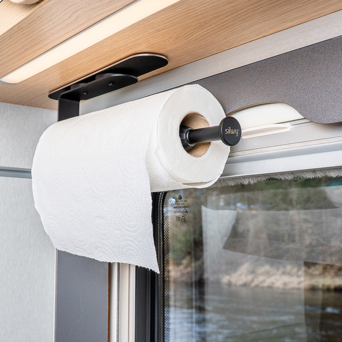 Kitchen roll holder on bar in the camper