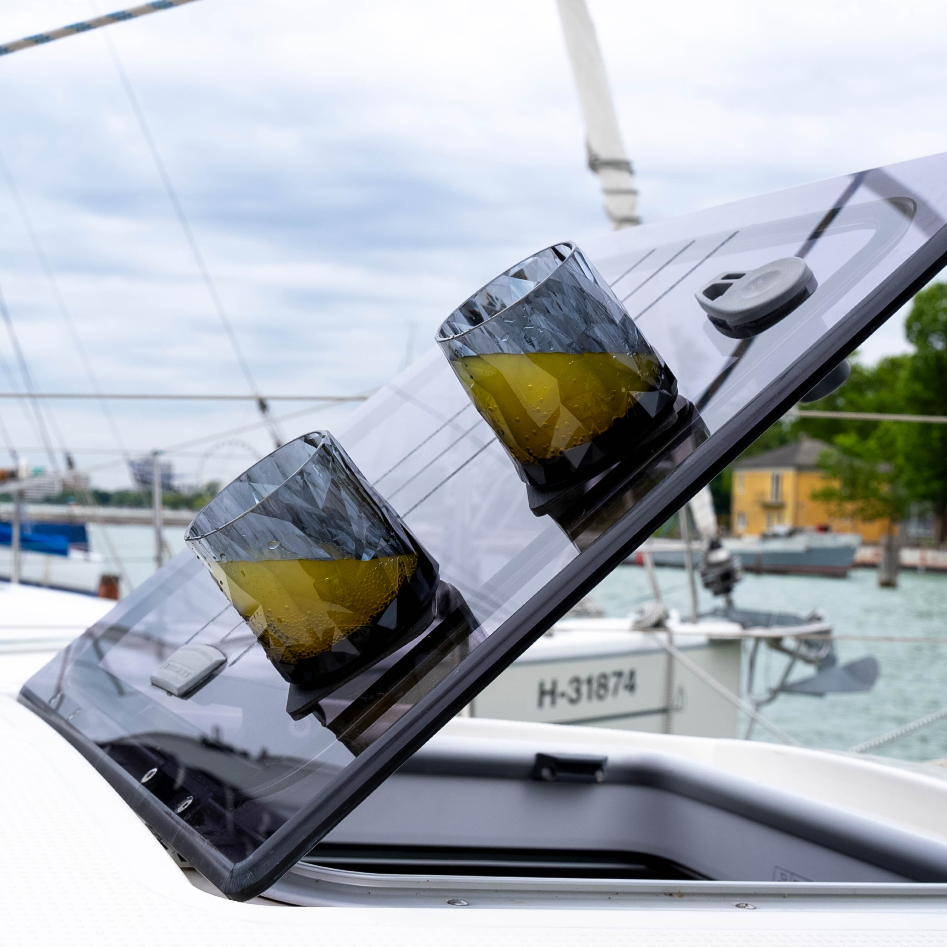 Magnetic plastic glasses tumbler placed on a pad on a boat in an inclined position
