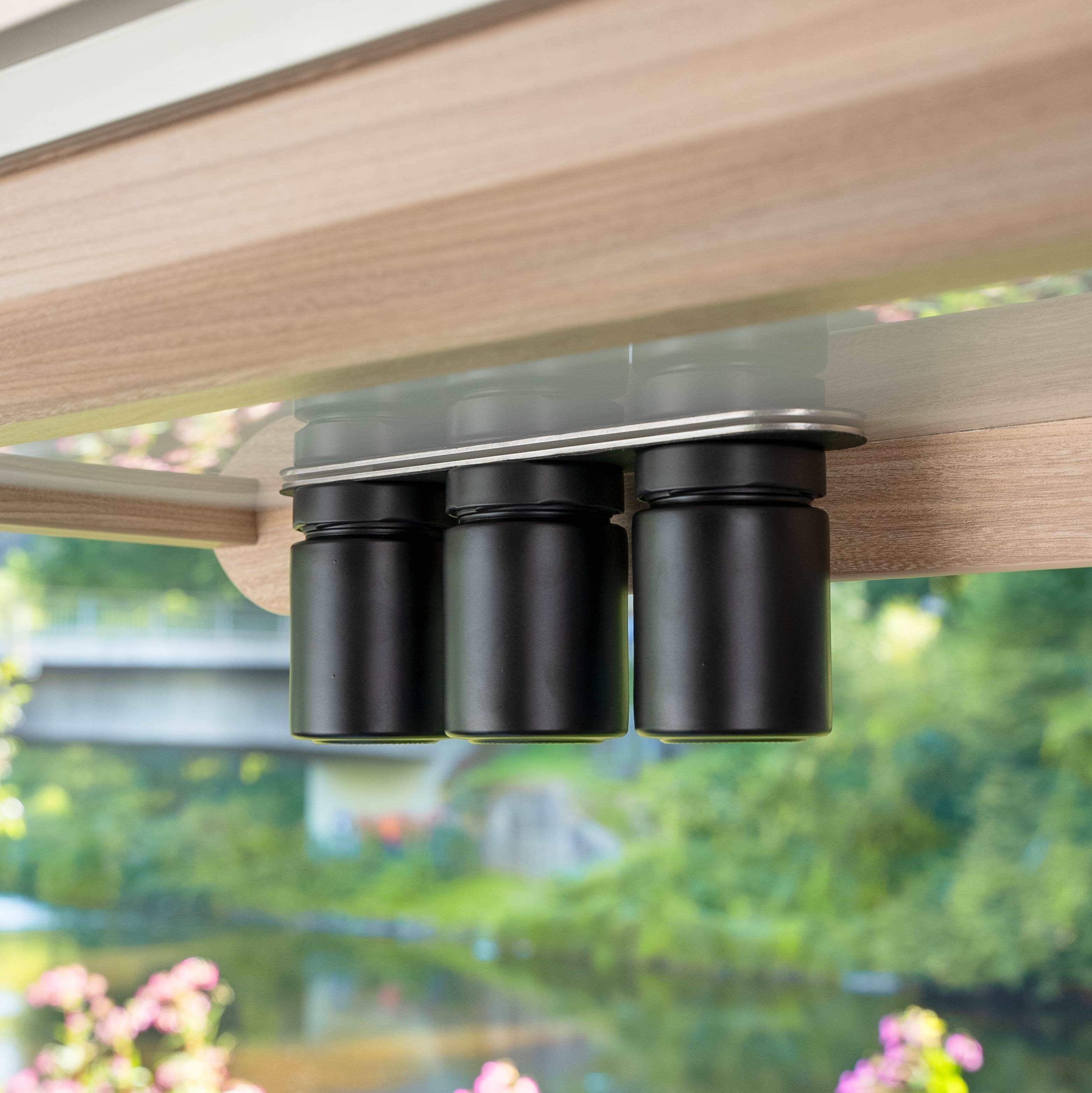Magnetic deli jars placed on bar in the camper