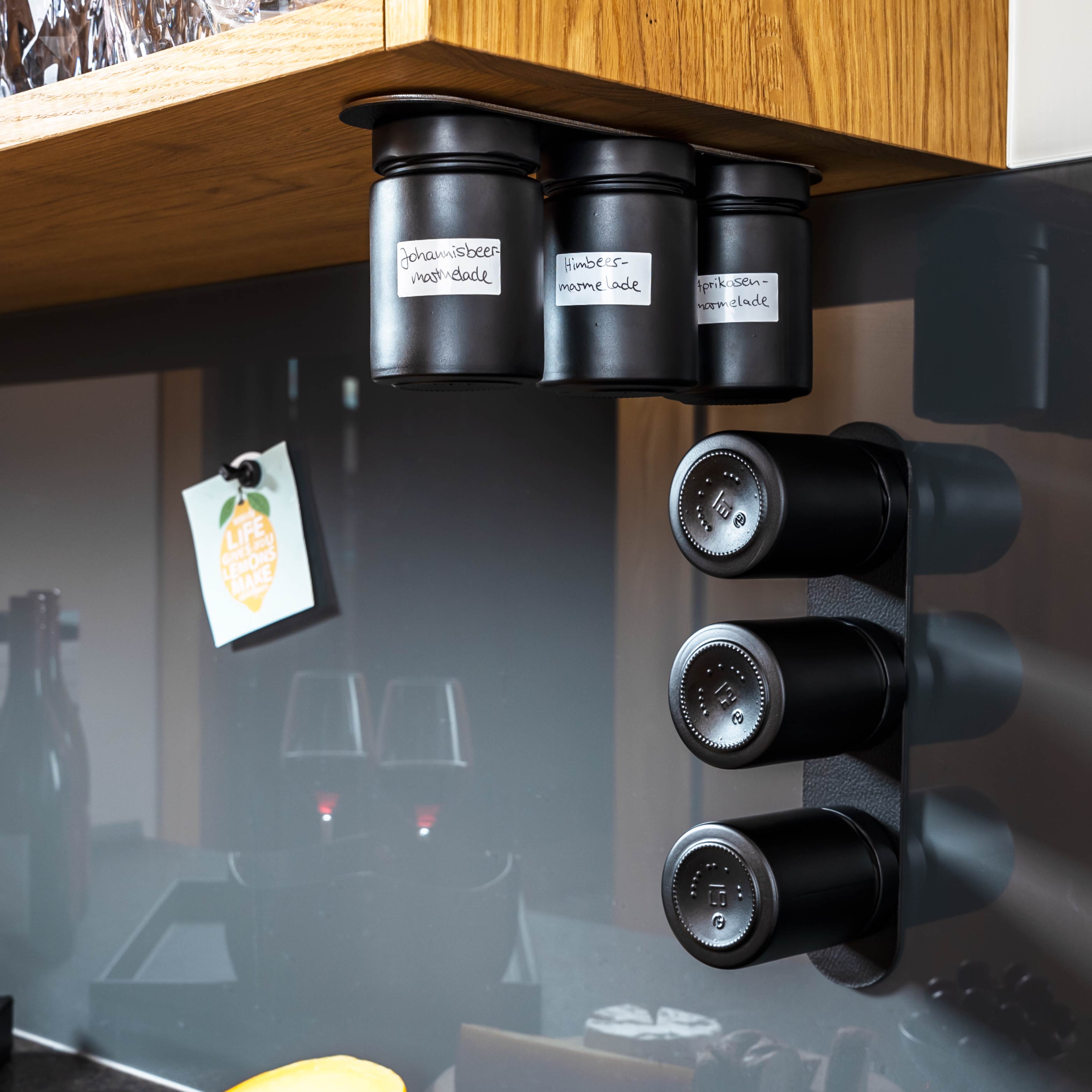 Magnetic deli jars mounted on Metal Strip in kitchen environment 