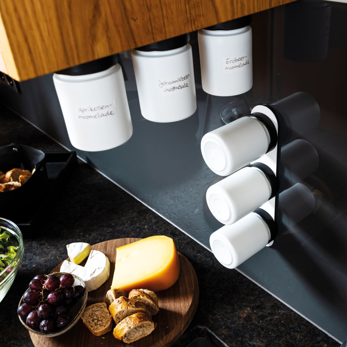 Magnetic deli jars mounted on Metal Strip in kitchen environment 