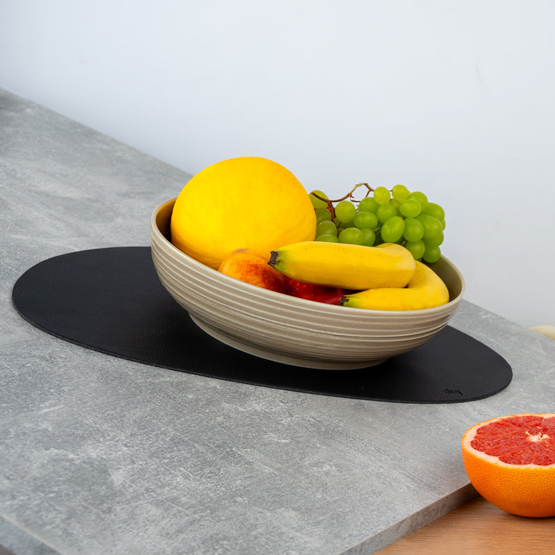 Food bowl standing at an angle on placemat