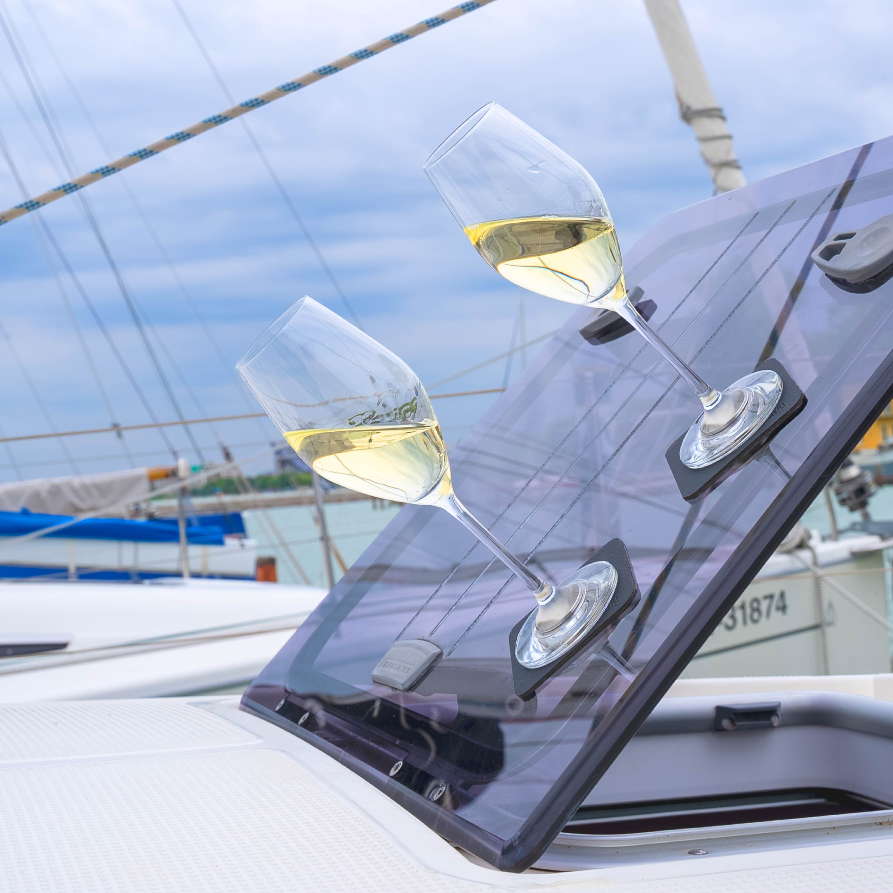 Magnetic crystal glasses champagne on pads in inclined position on a boat