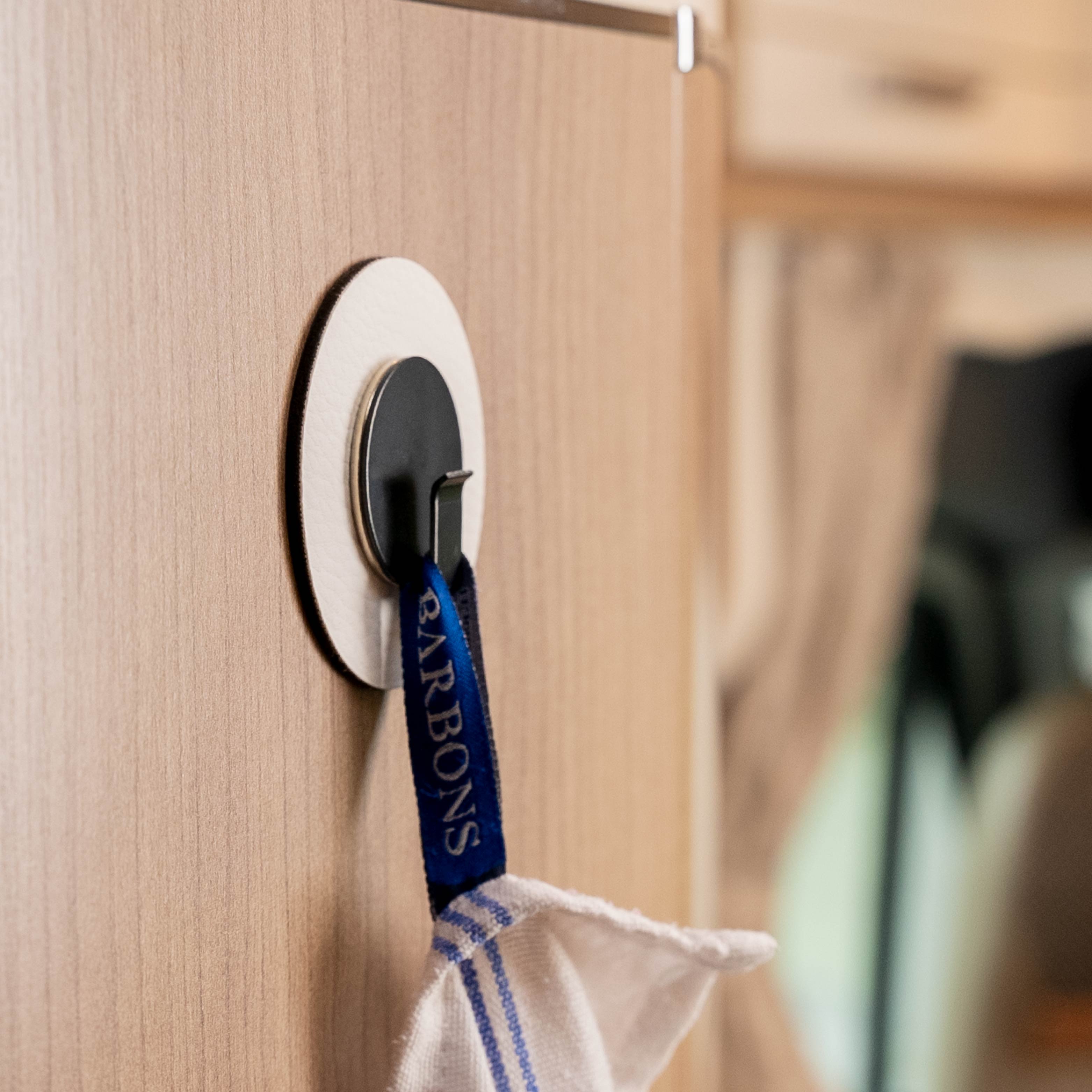 Application: Dish towel is fixed by hook Clever in combination with the pad in a camper