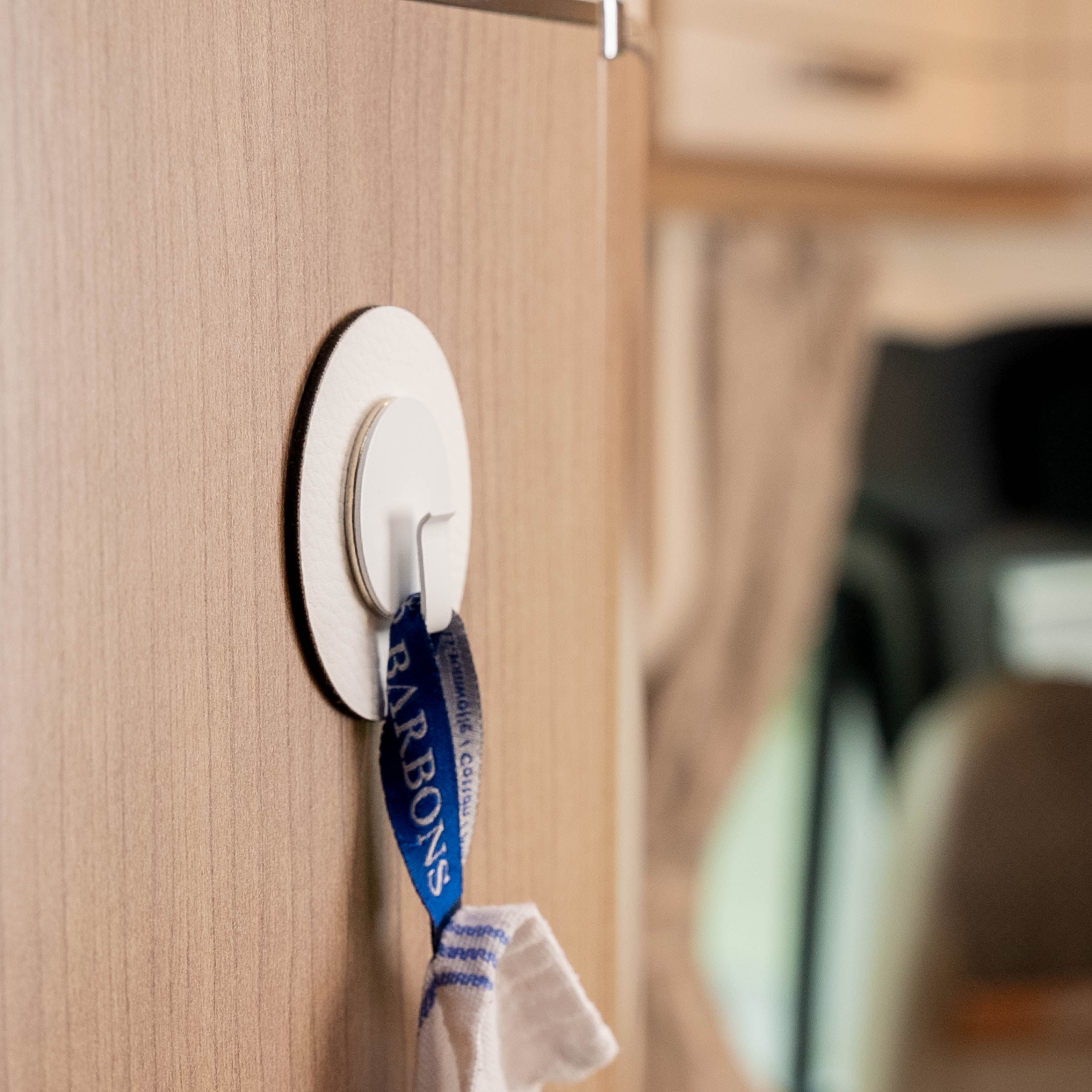 Application: Dish towel is fixed by hook Clever in combination with the pad in a camper