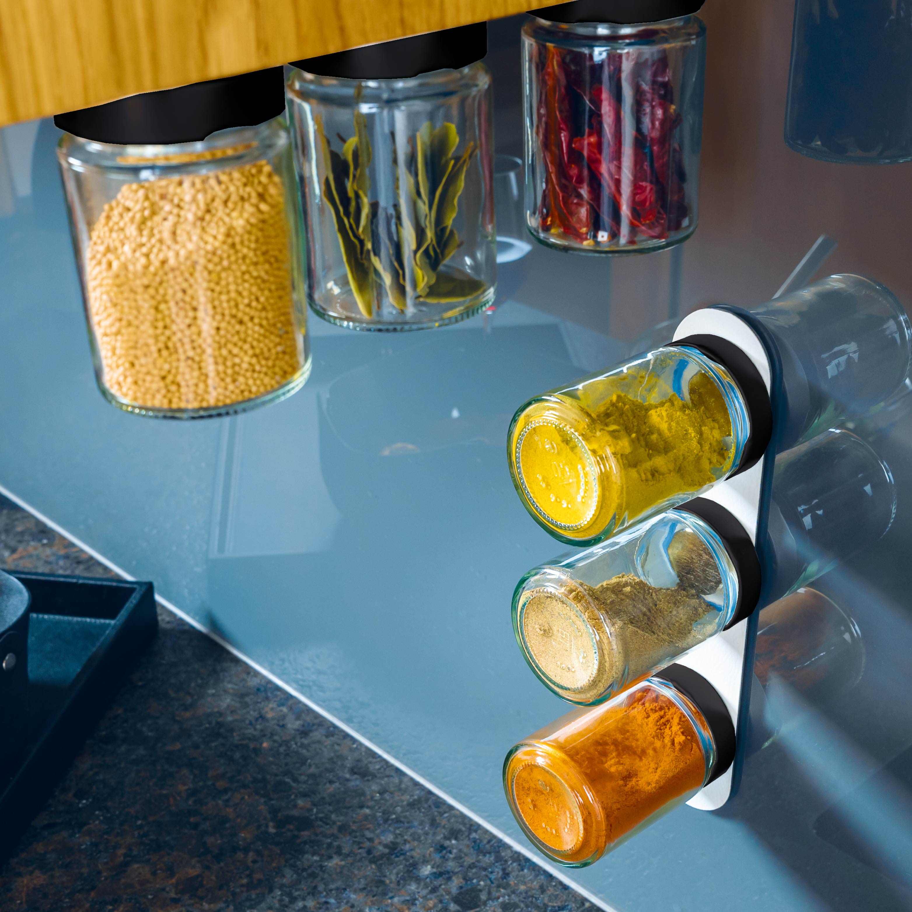 Delicatessen jars attached to the ledge in the kitchen environment